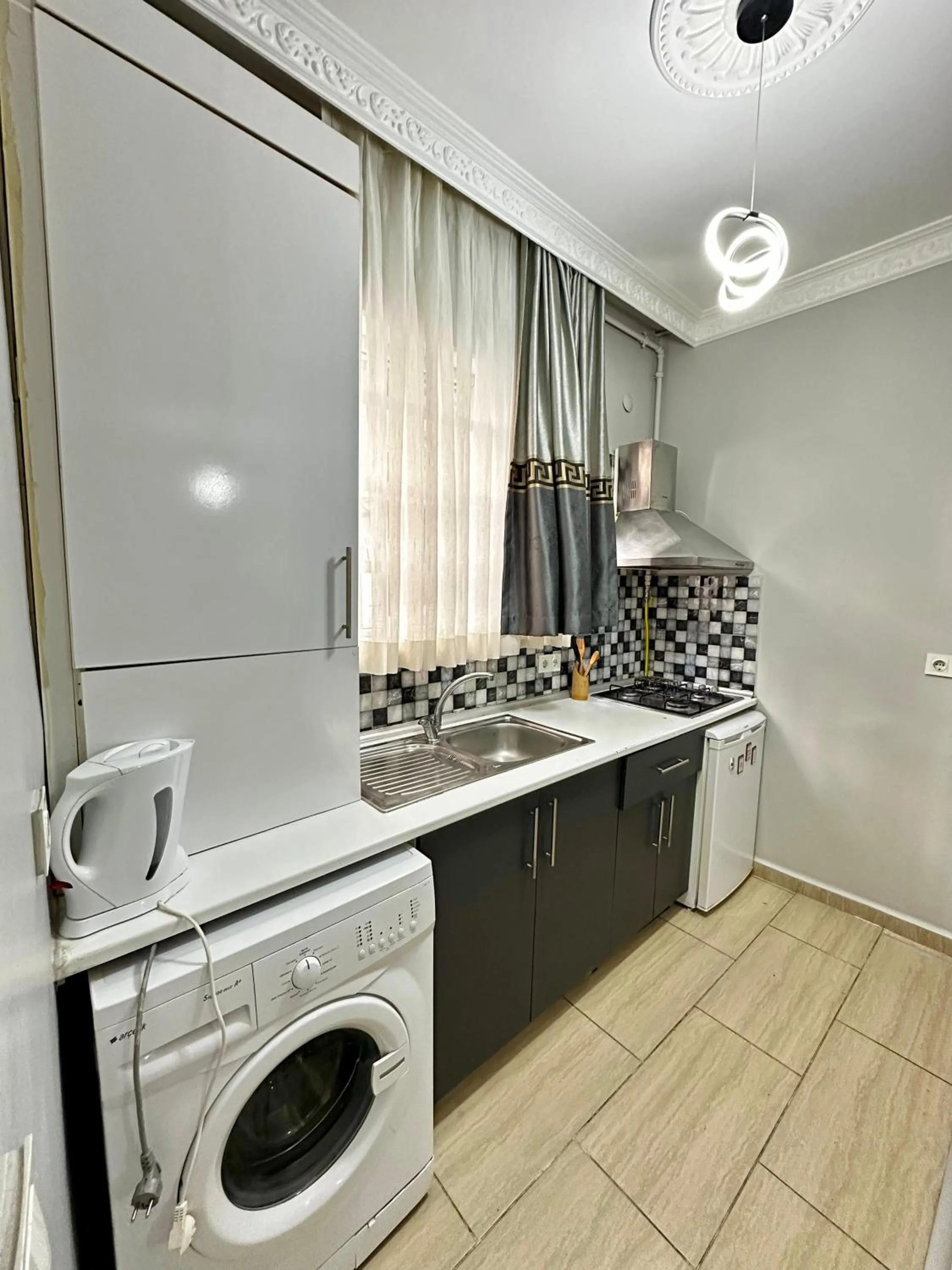 Kitchen or kitchenette in Blueway Hotel Residence