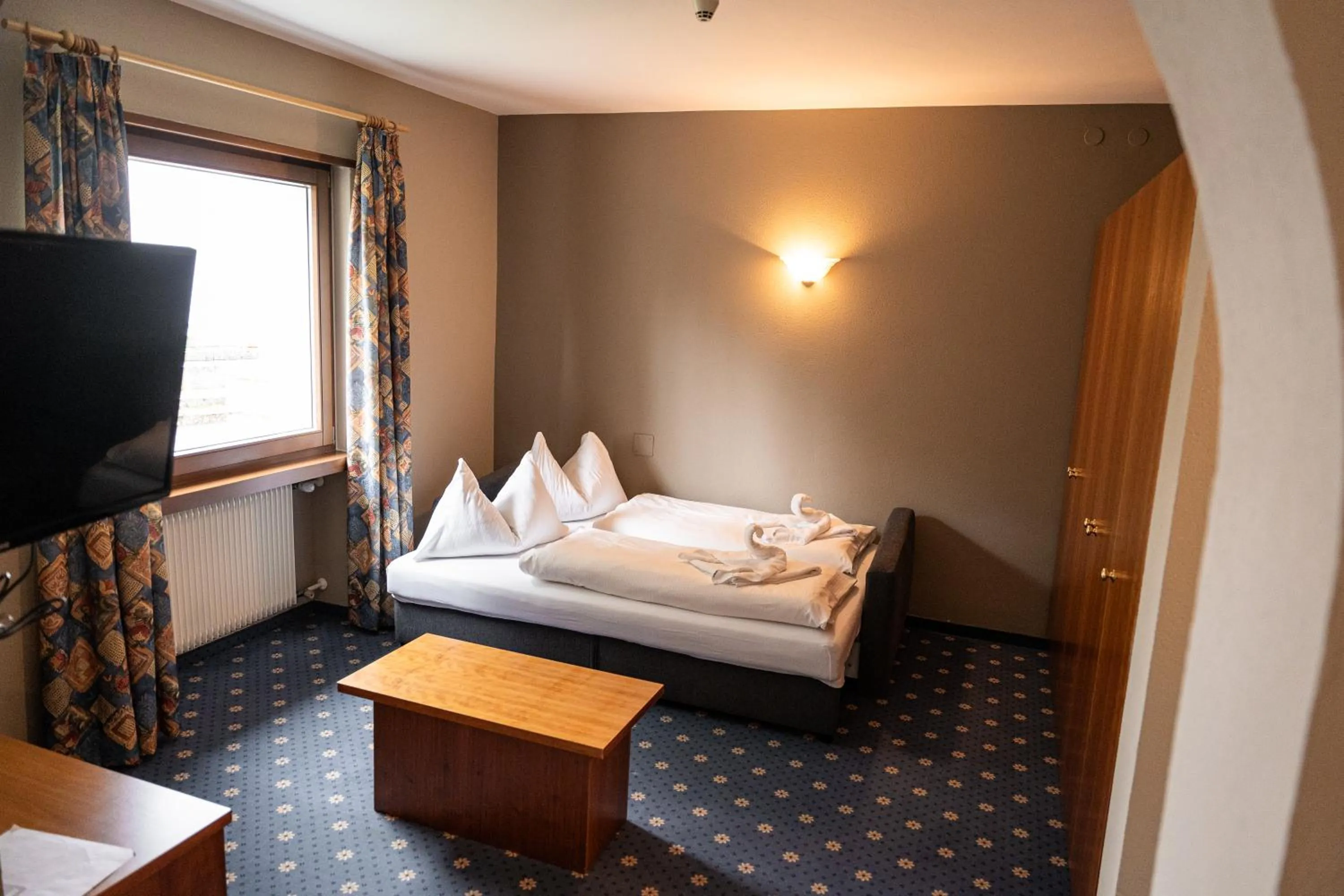 Bedroom in PanoramaHotel Penegal