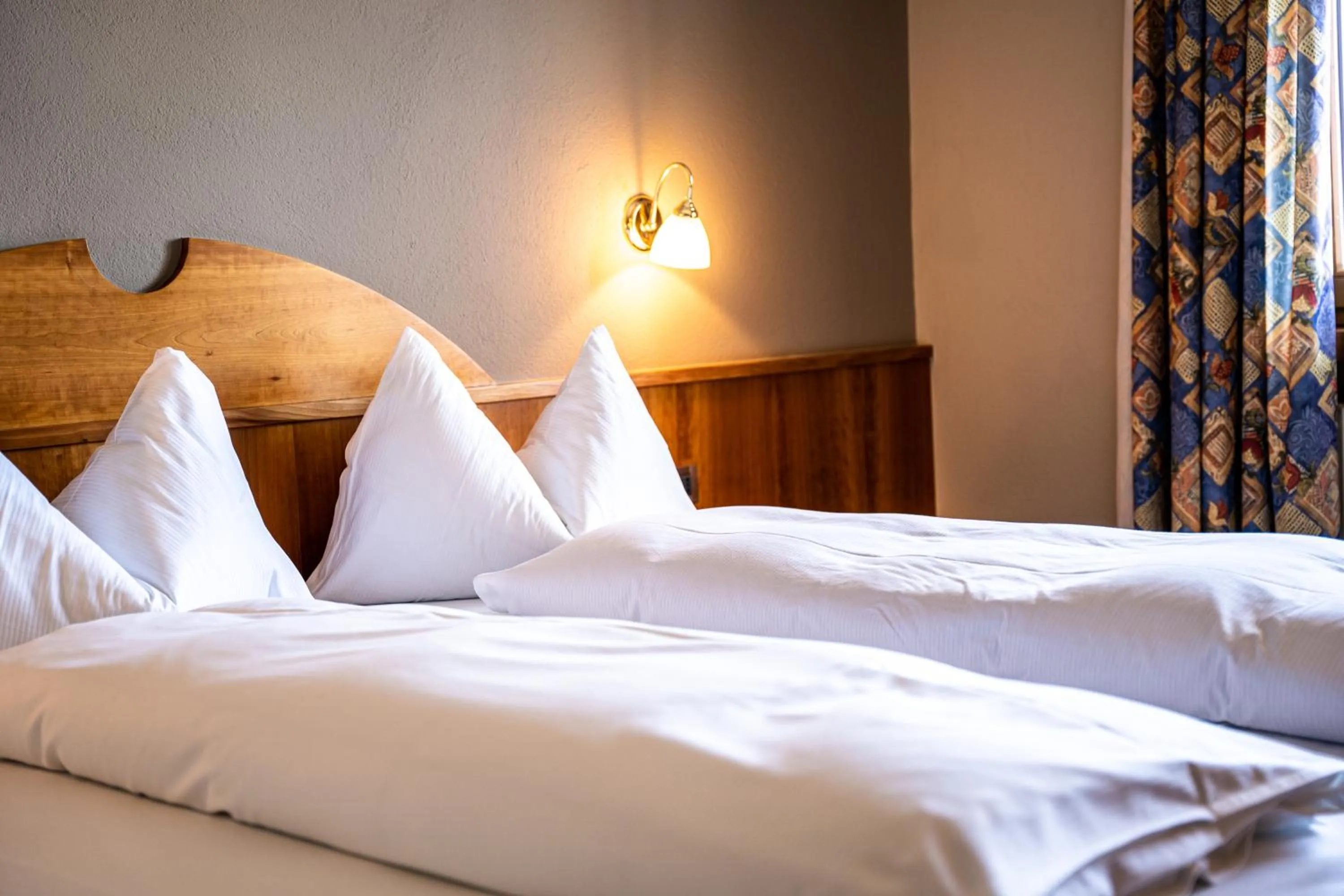 Bed in PanoramaHotel Penegal