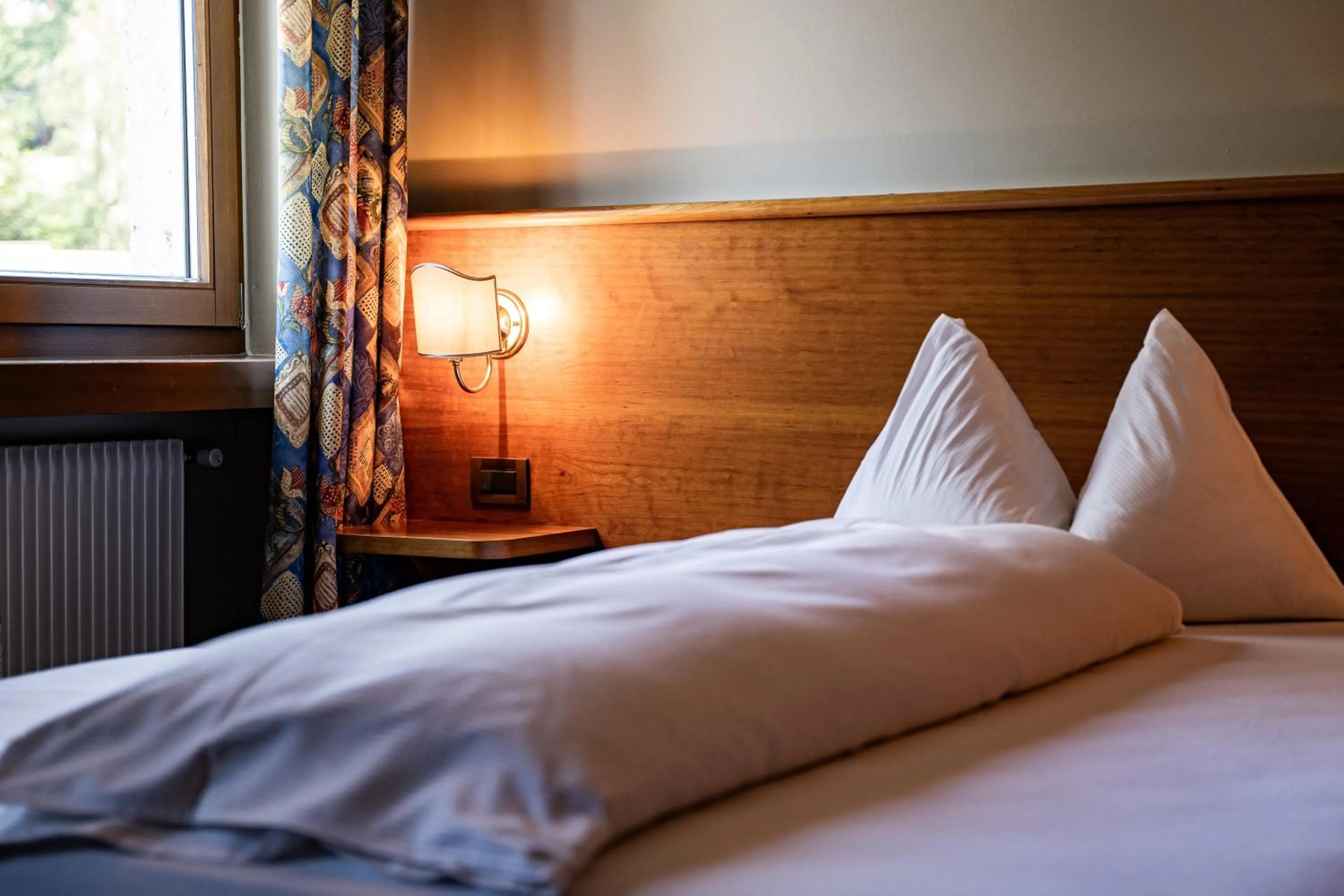 Bed in PanoramaHotel Penegal