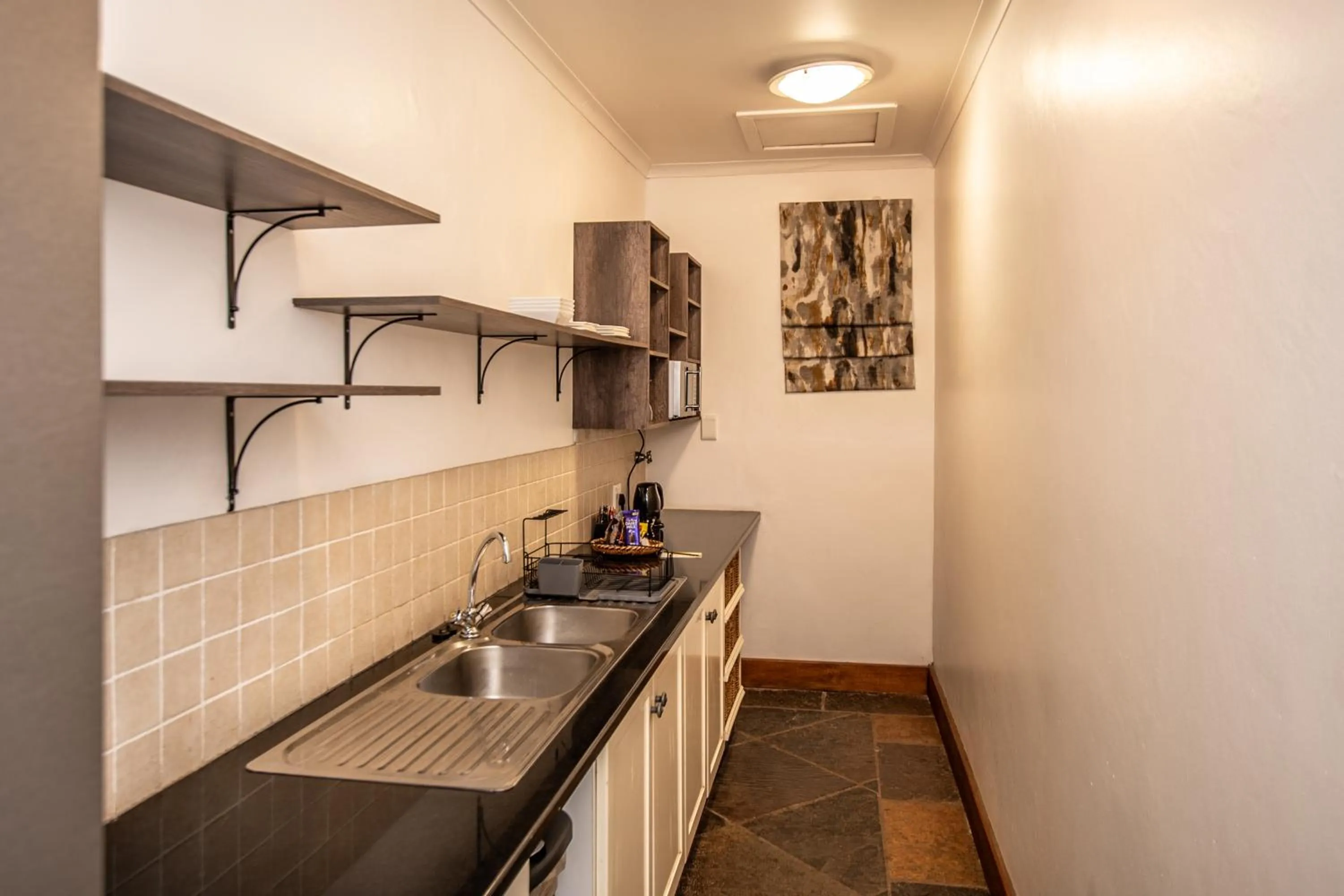 Kitchen or kitchenette in Nut Grove Boutique Hotel