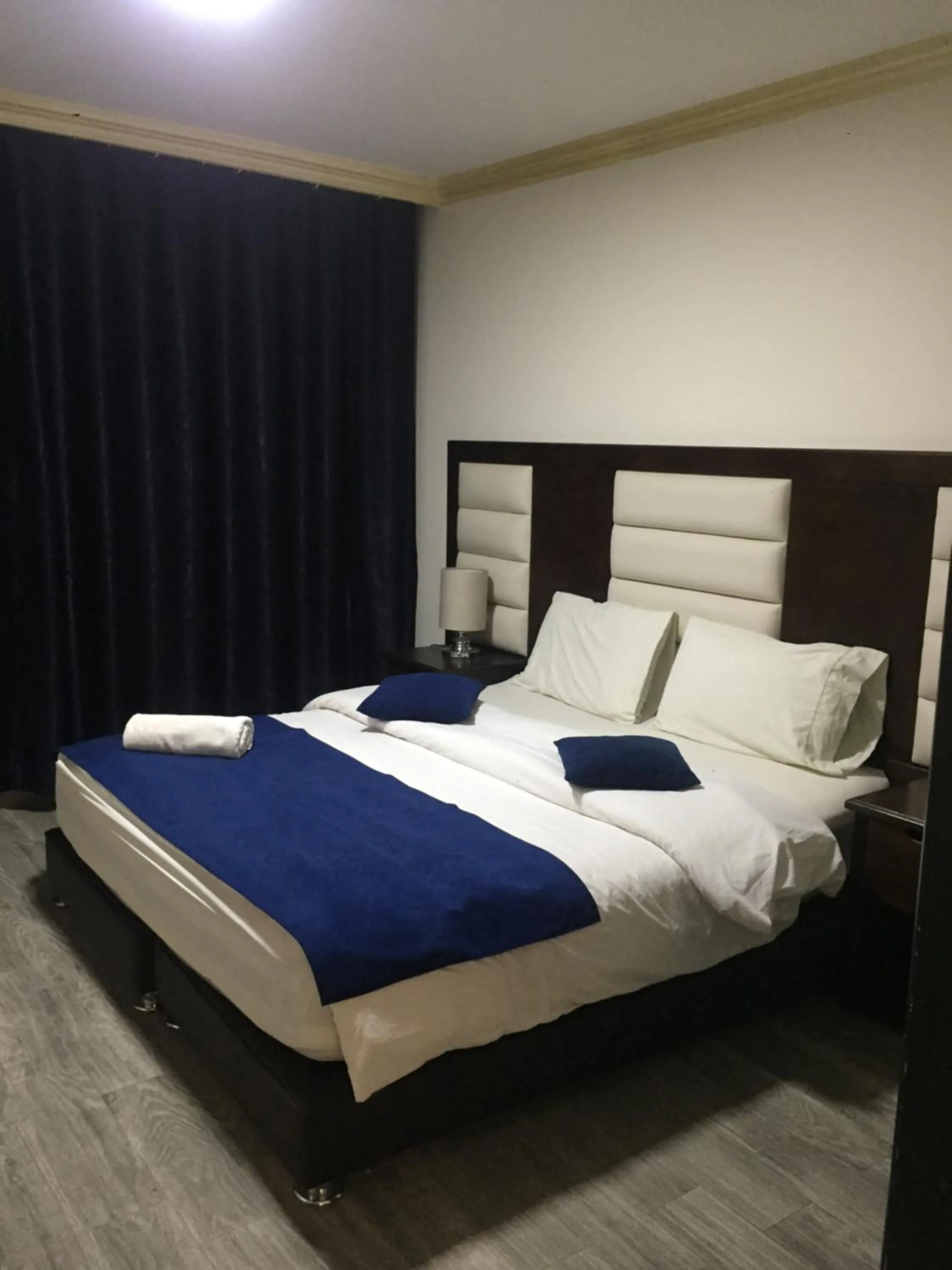 Bed in Uptown Hotel Apartment