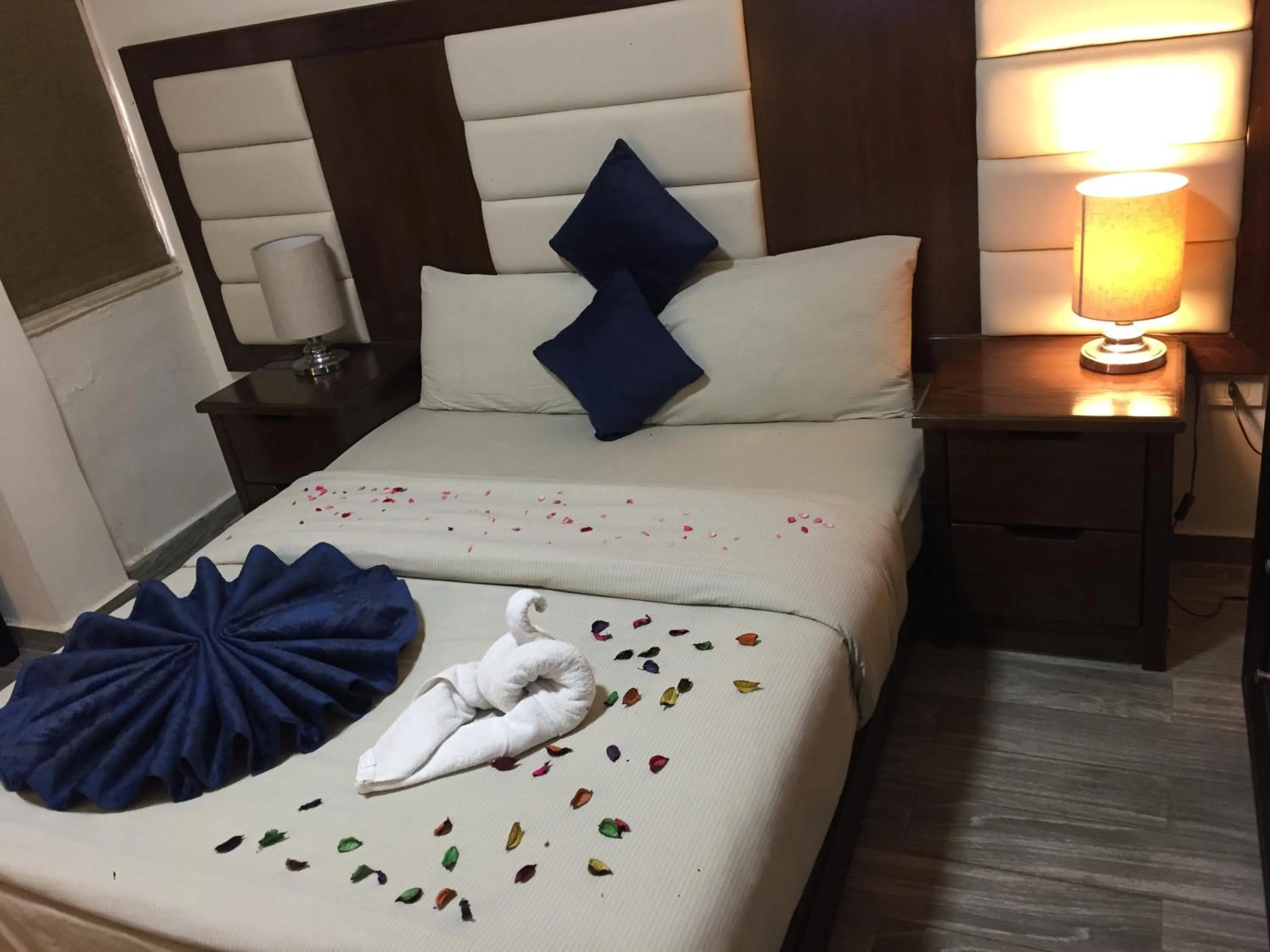 Bed in Uptown Hotel Apartment