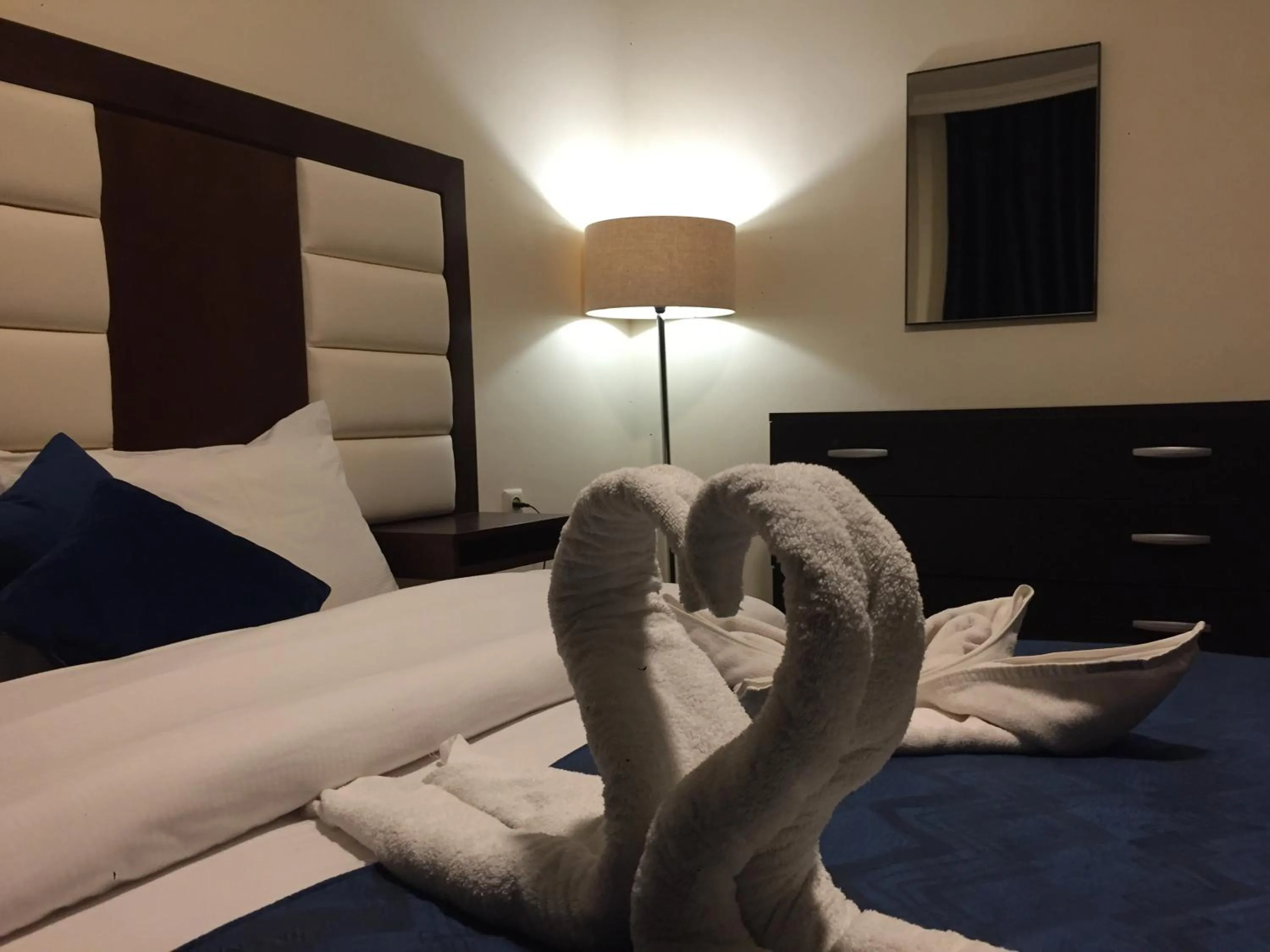 Bed in Uptown Hotel Apartment