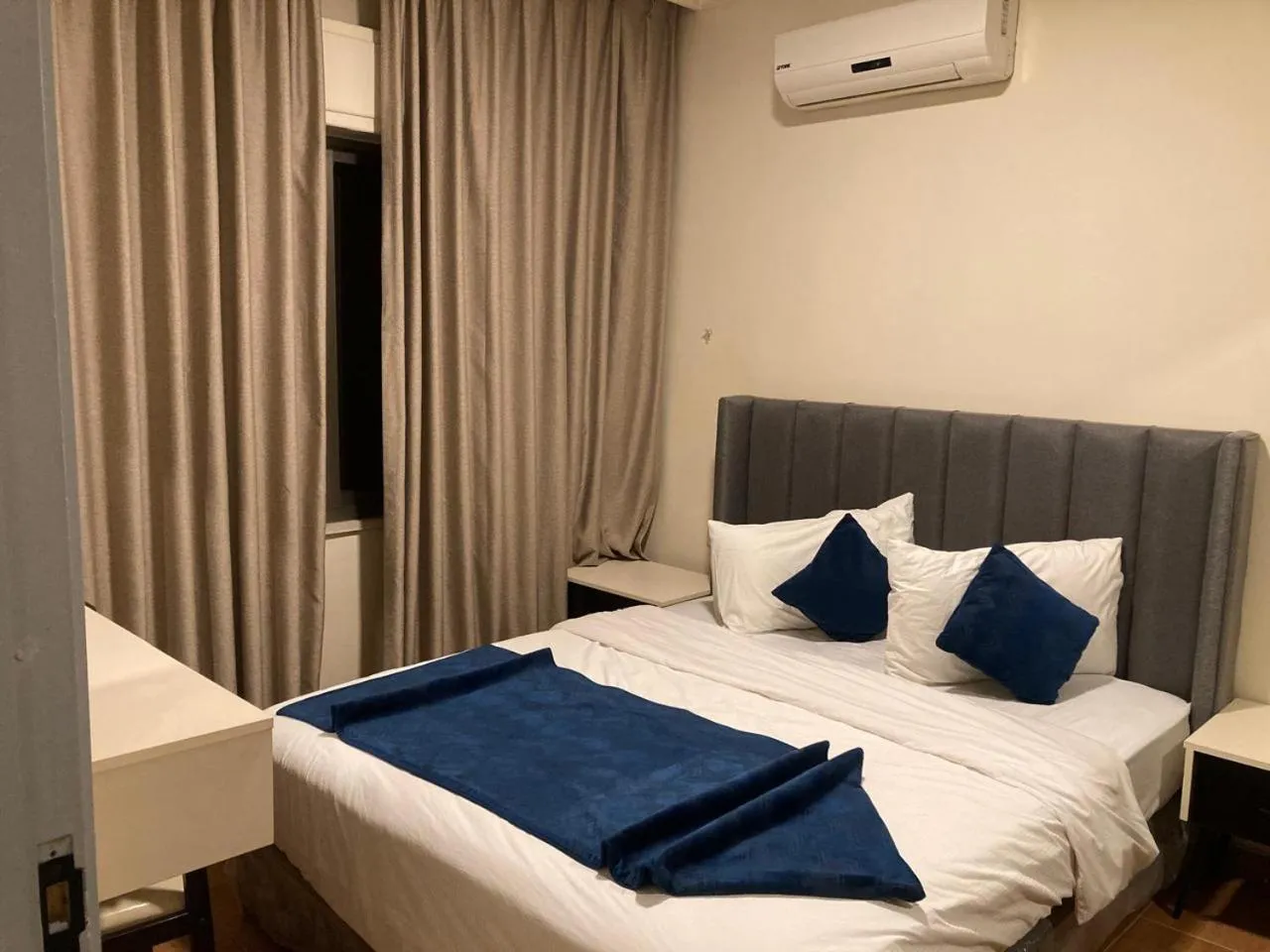 Bed in Uptown Hotel Apartment