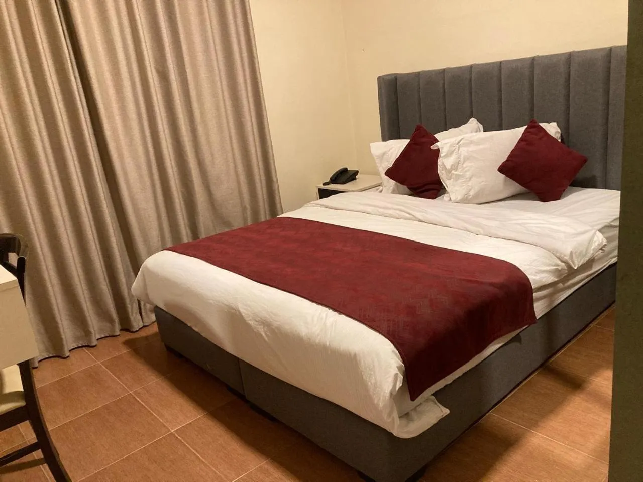 Bed in Uptown Hotel Apartment