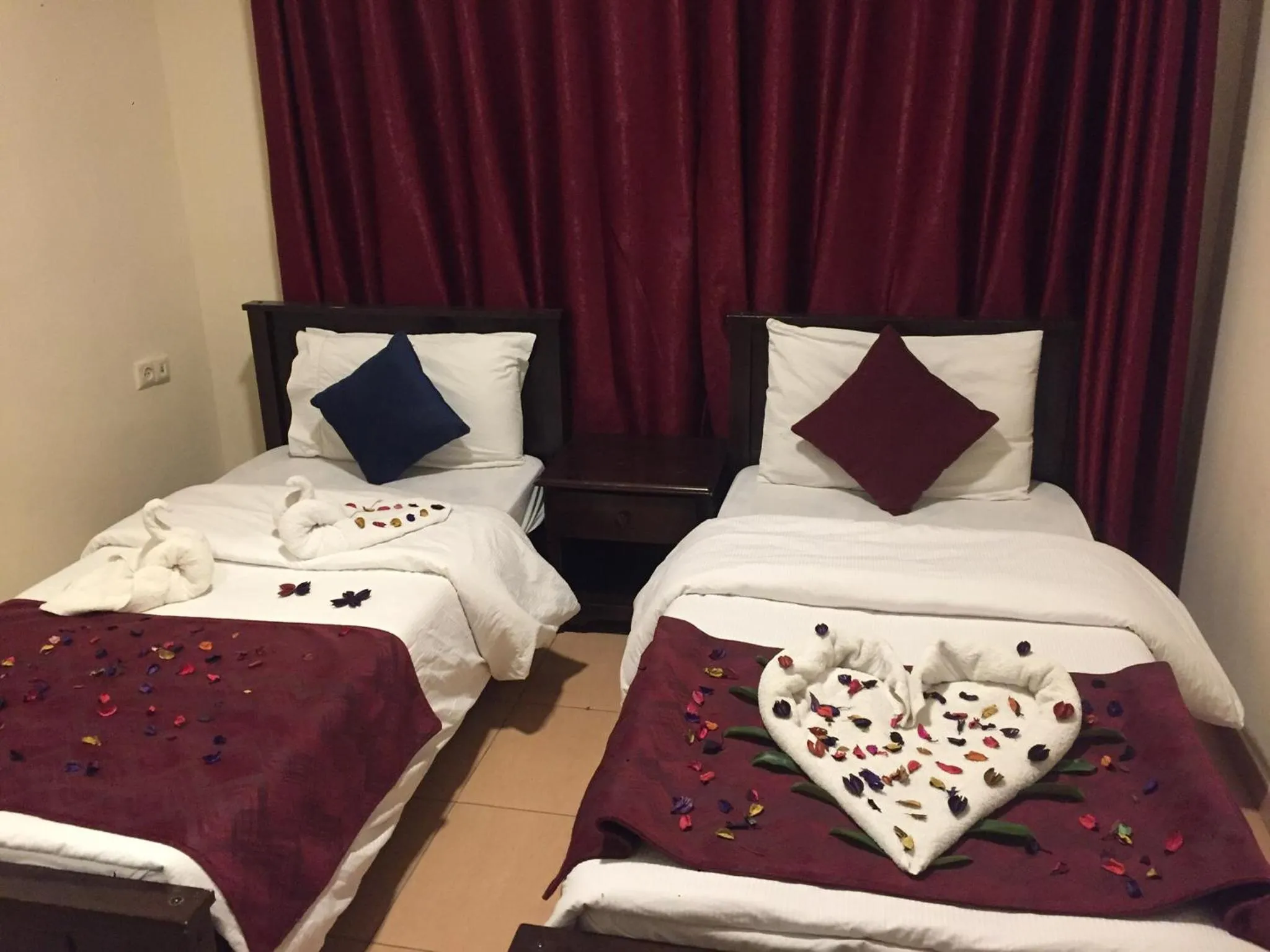 Bed in Uptown Hotel Apartment