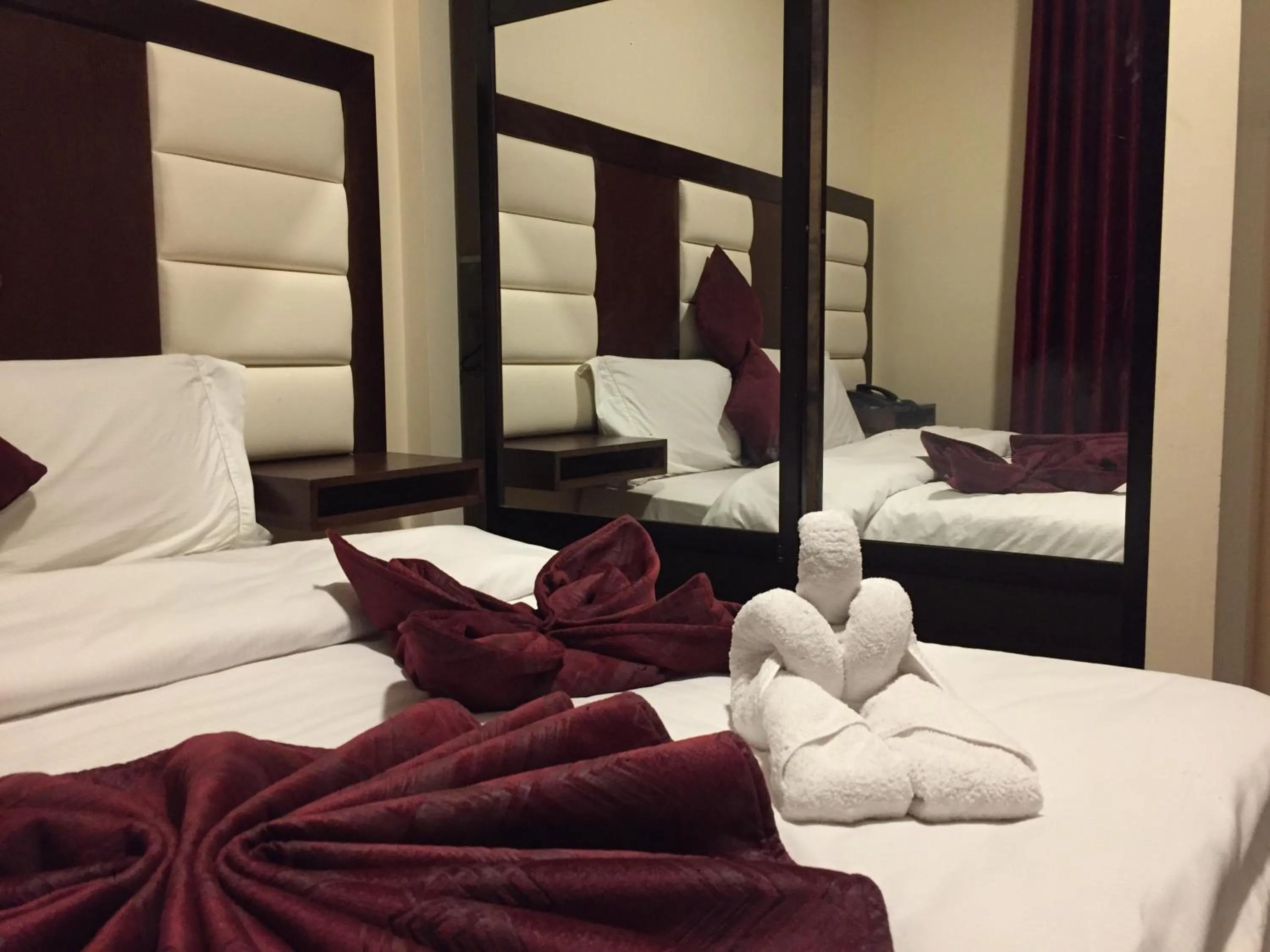 Bed in Uptown Hotel Apartment