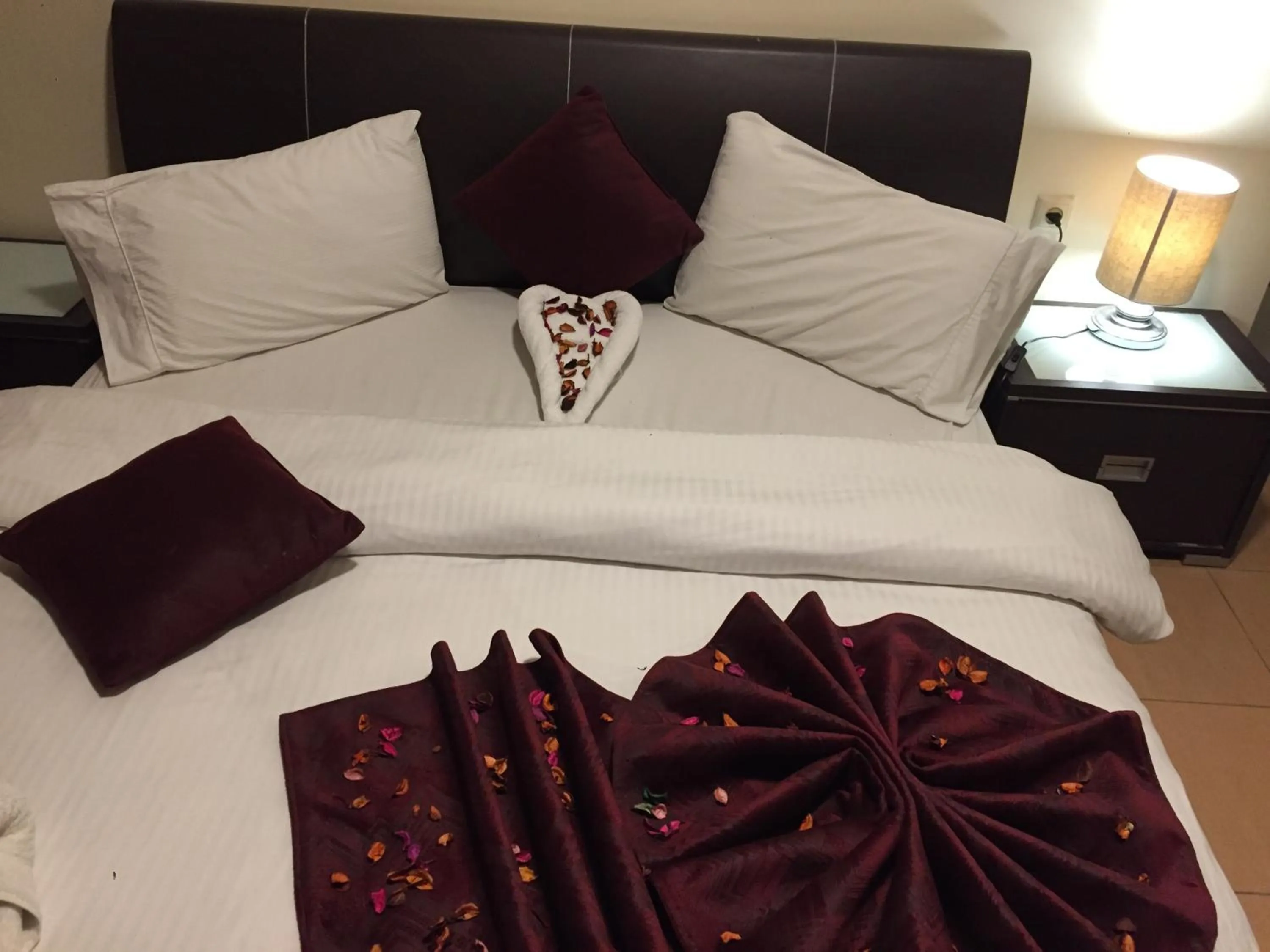 Bed in Uptown Hotel Apartment