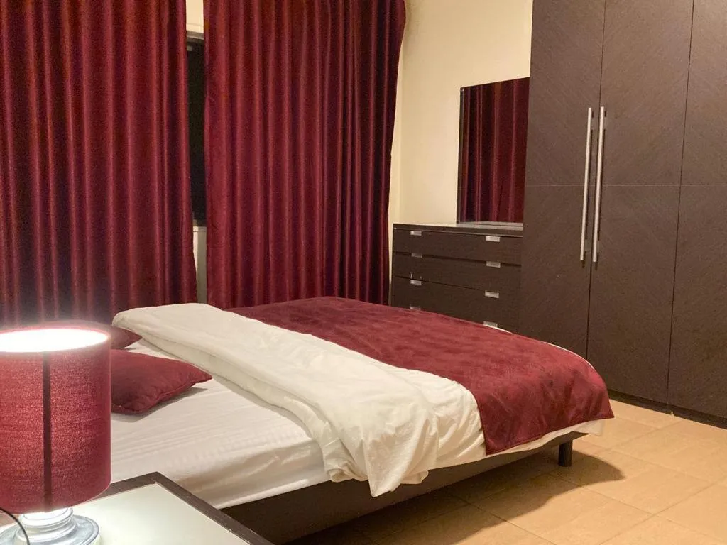 Bed in Uptown Hotel Apartment