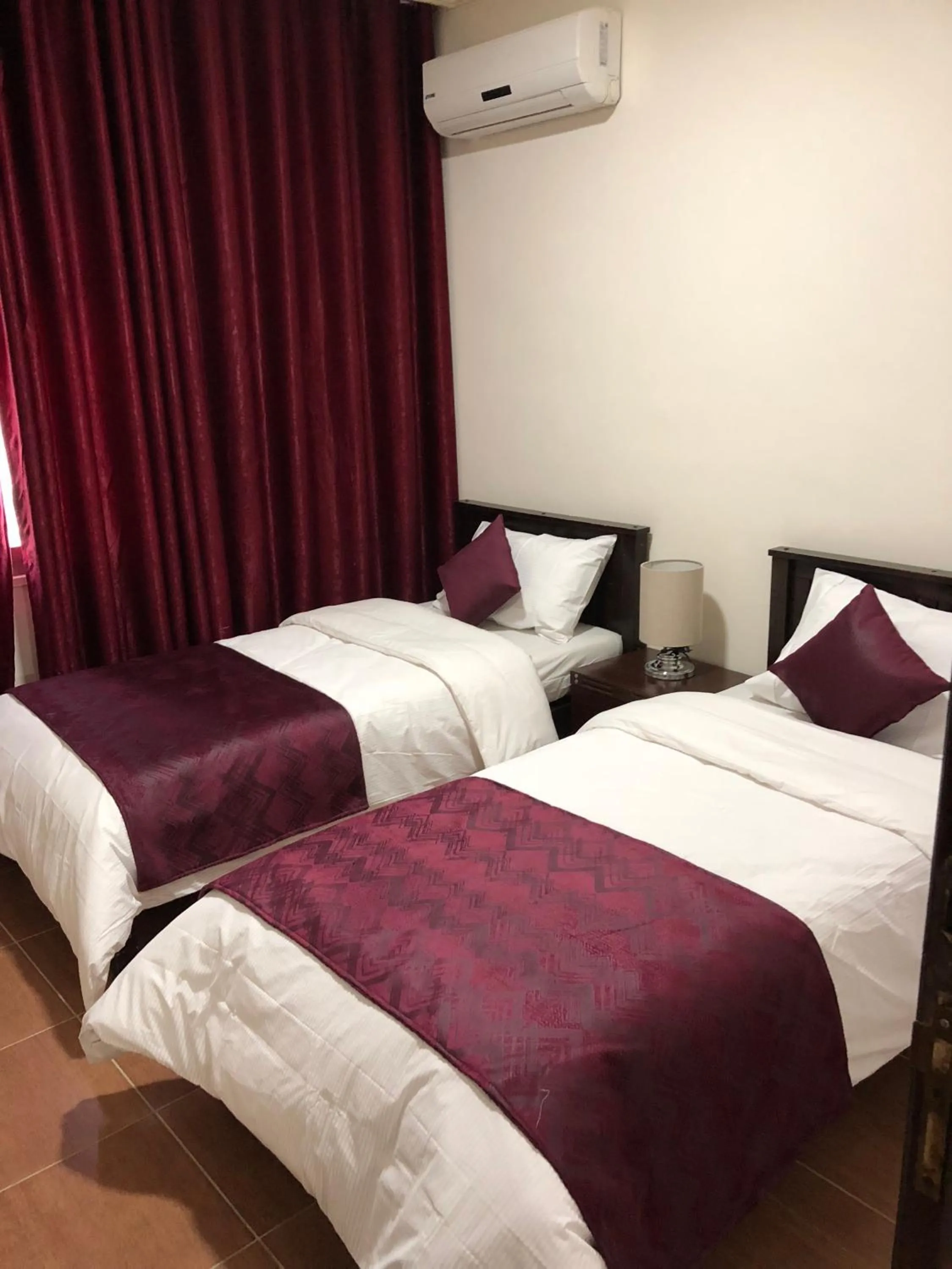 Bed in Uptown Hotel Apartment