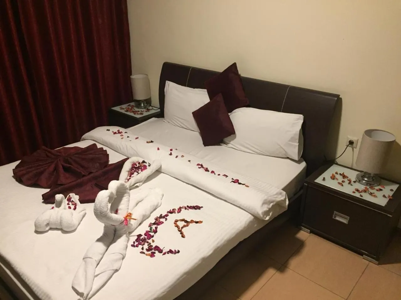 Bed in Uptown Hotel Apartment