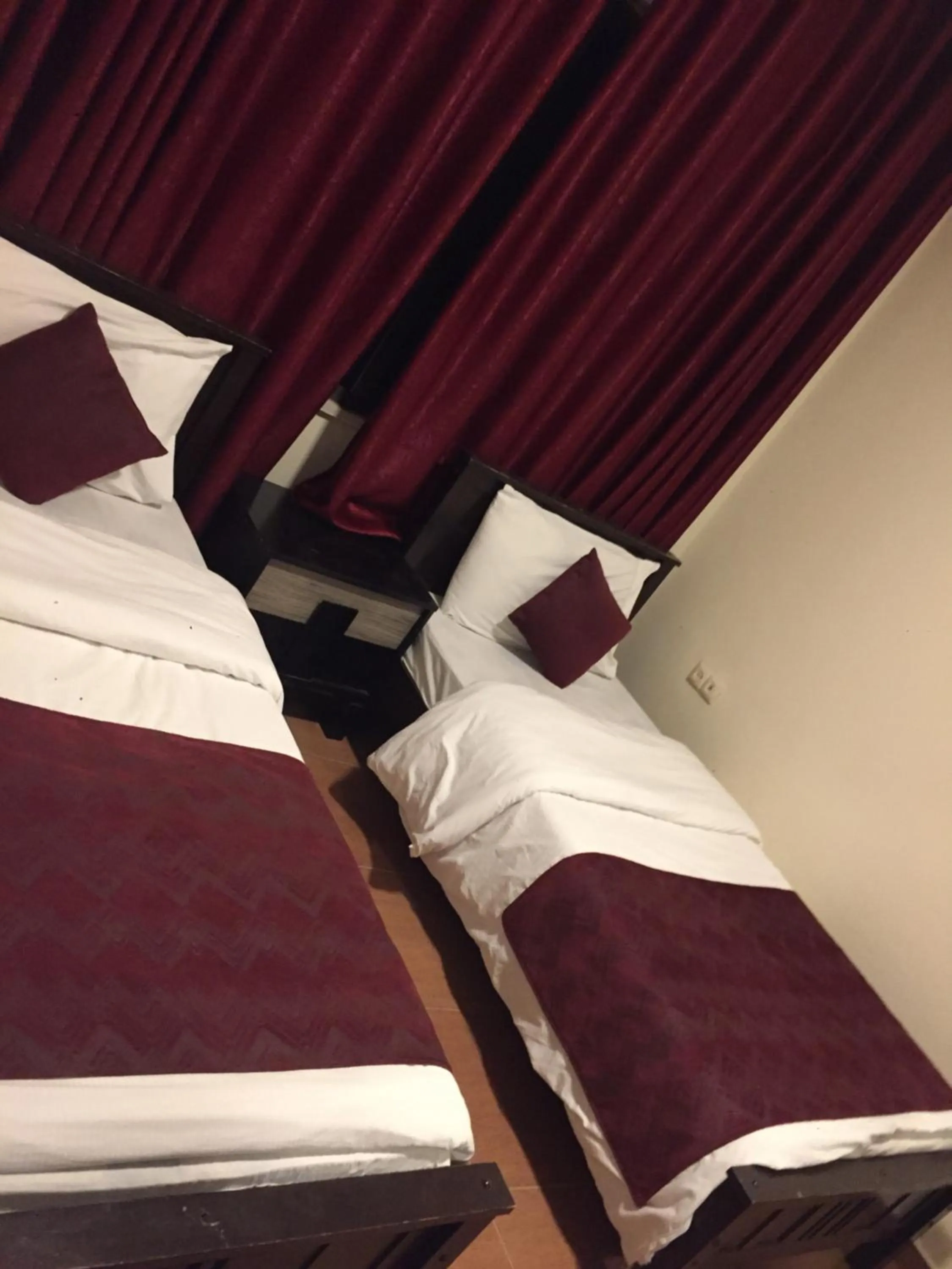 Bed in Uptown Hotel Apartment