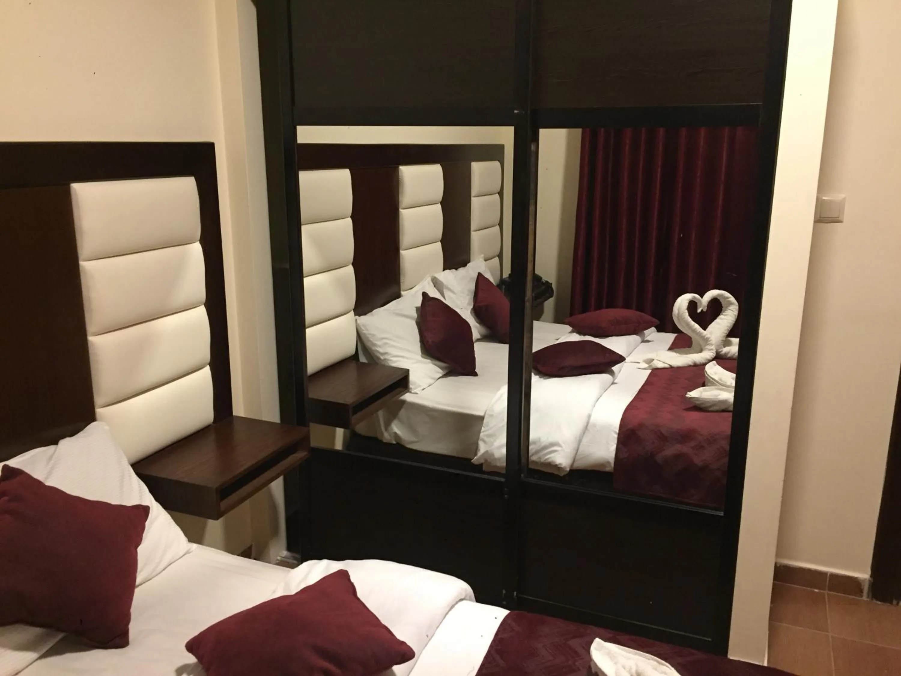 Bed in Uptown Hotel Apartment