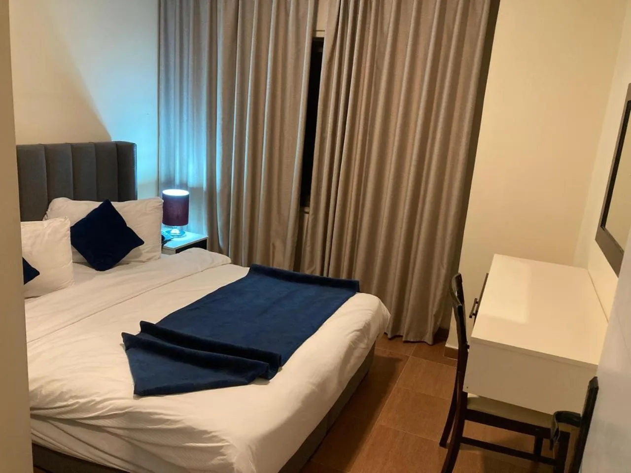 Bed in Uptown Hotel Apartment