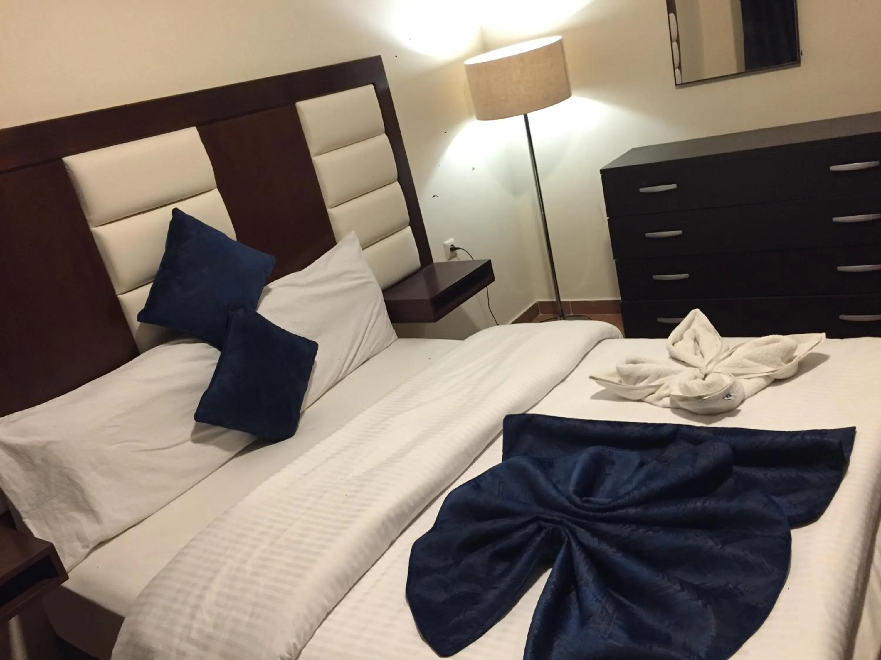 Bed in Uptown Hotel Apartment