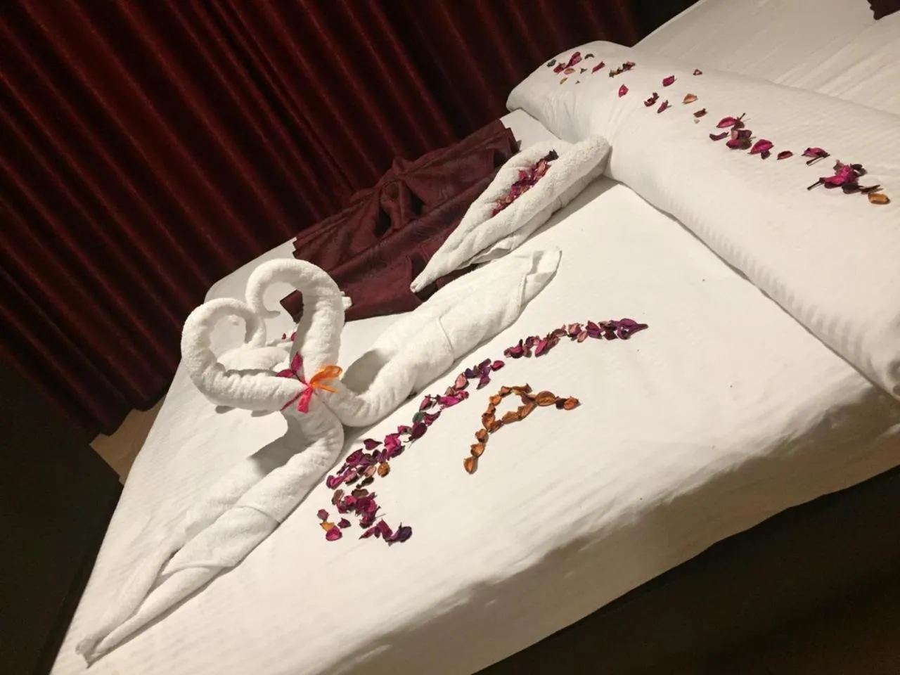 Bed in Uptown Hotel Apartment