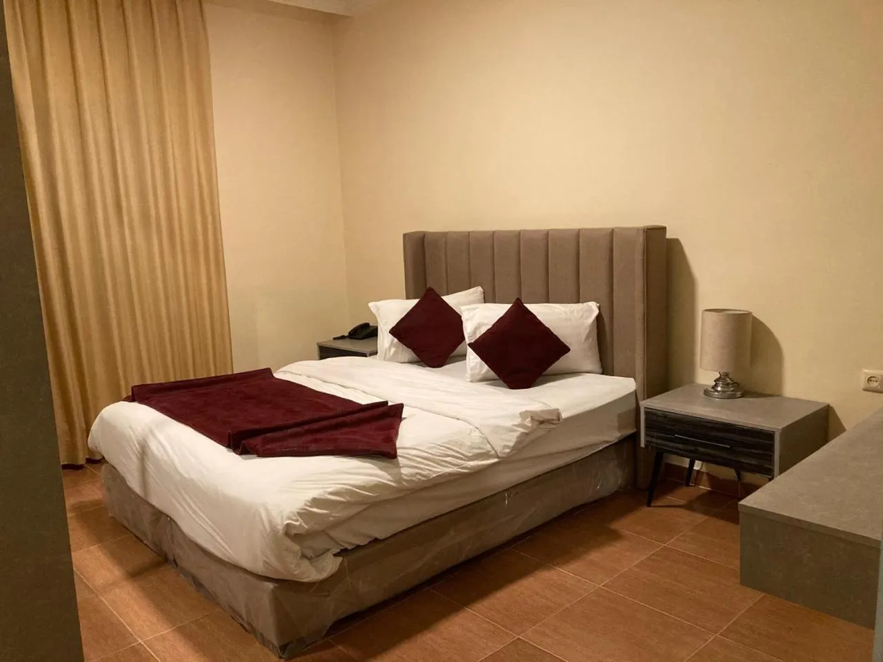 Bed in Uptown Hotel Apartment