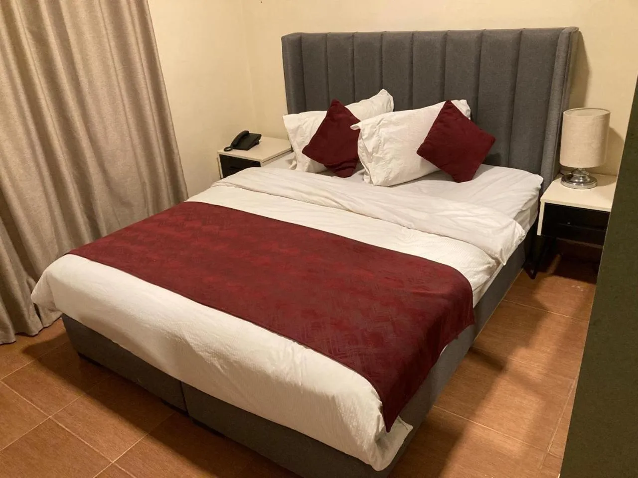 Bed in Uptown Hotel Apartment