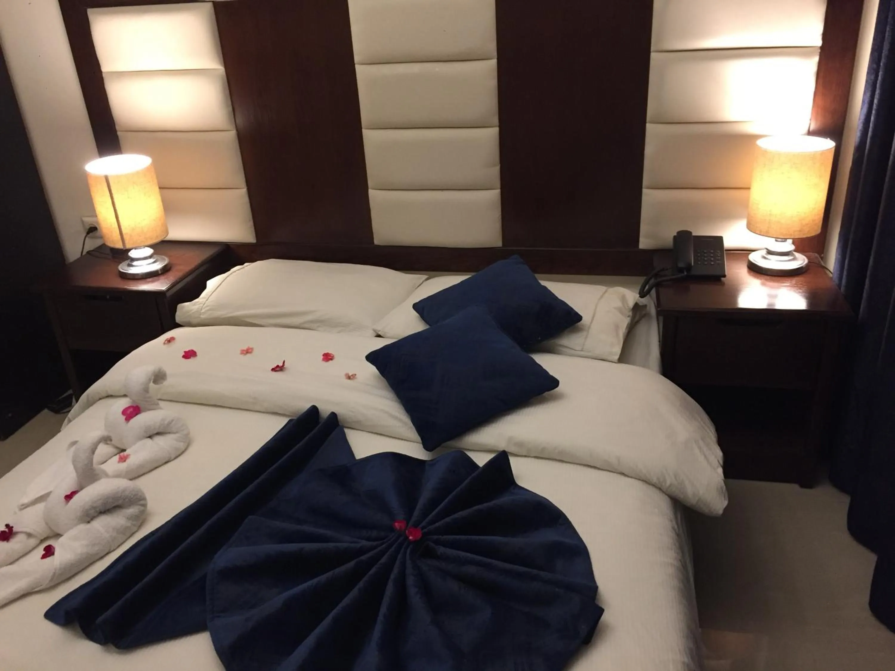 Bed in Uptown Hotel Apartment