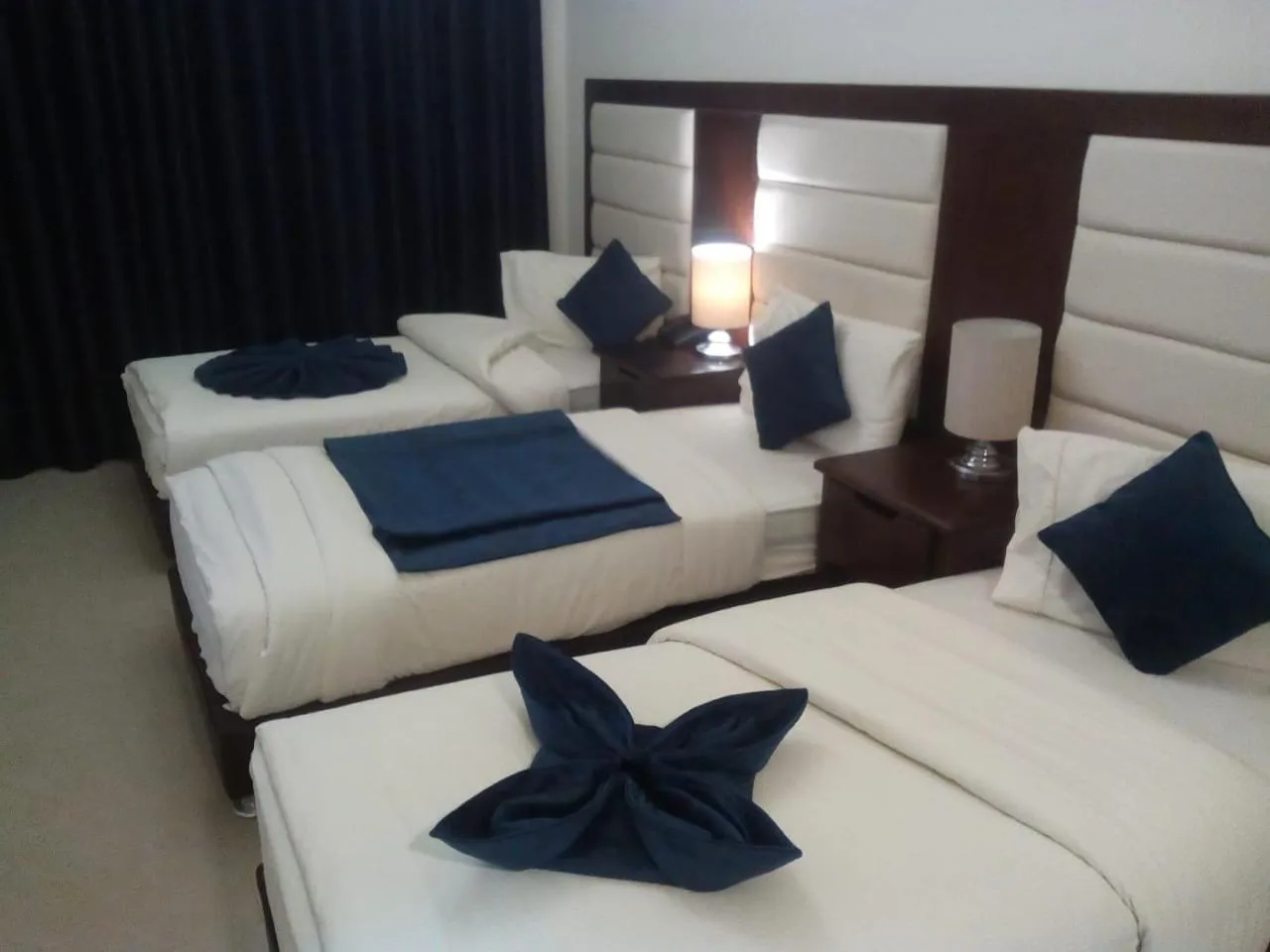 Bed in Uptown Hotel Apartment