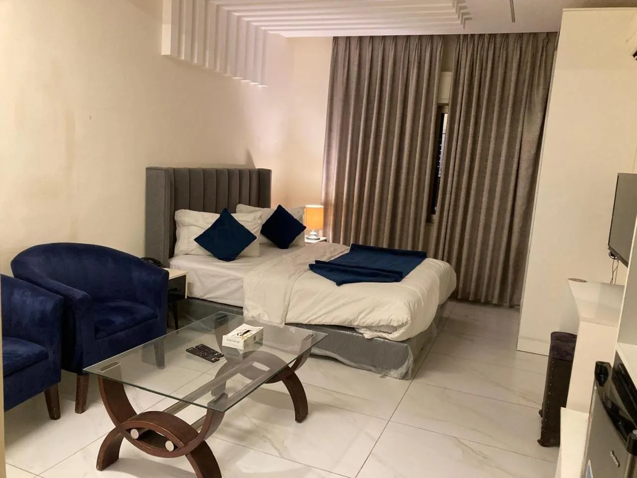 Bed in Uptown Hotel Apartment