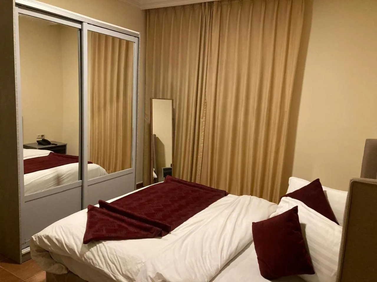 Bed in Uptown Hotel Apartment