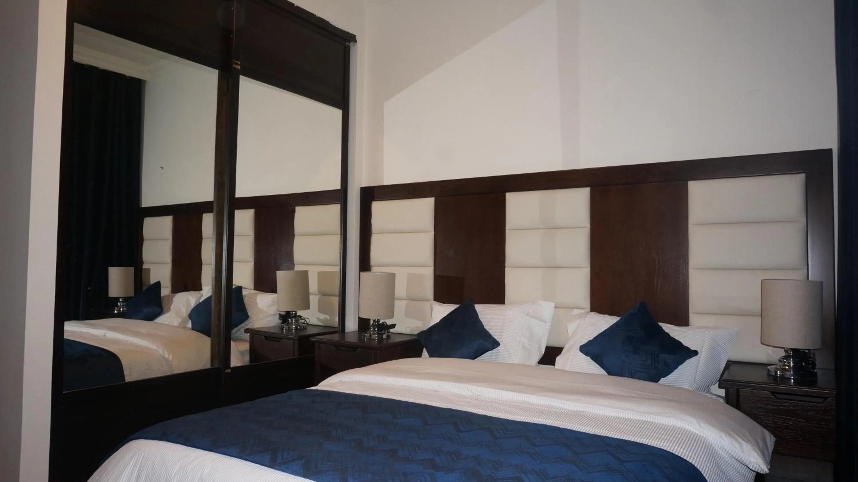 Bed in Uptown Hotel Apartment