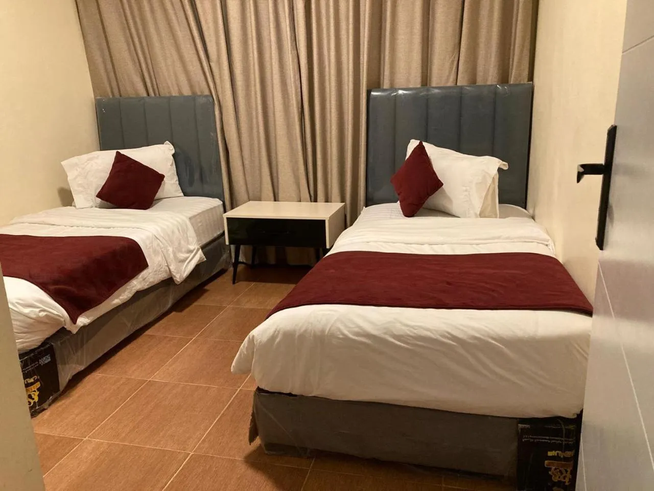 Bed in Uptown Hotel Apartment