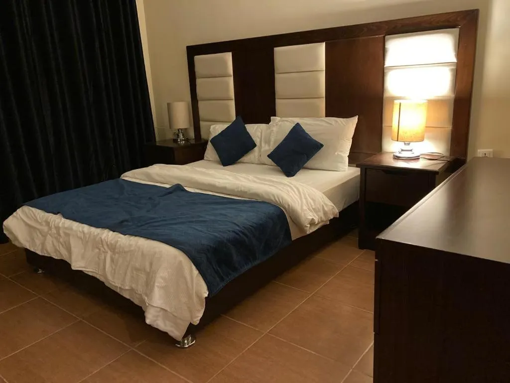 Bed in Uptown Hotel Apartment