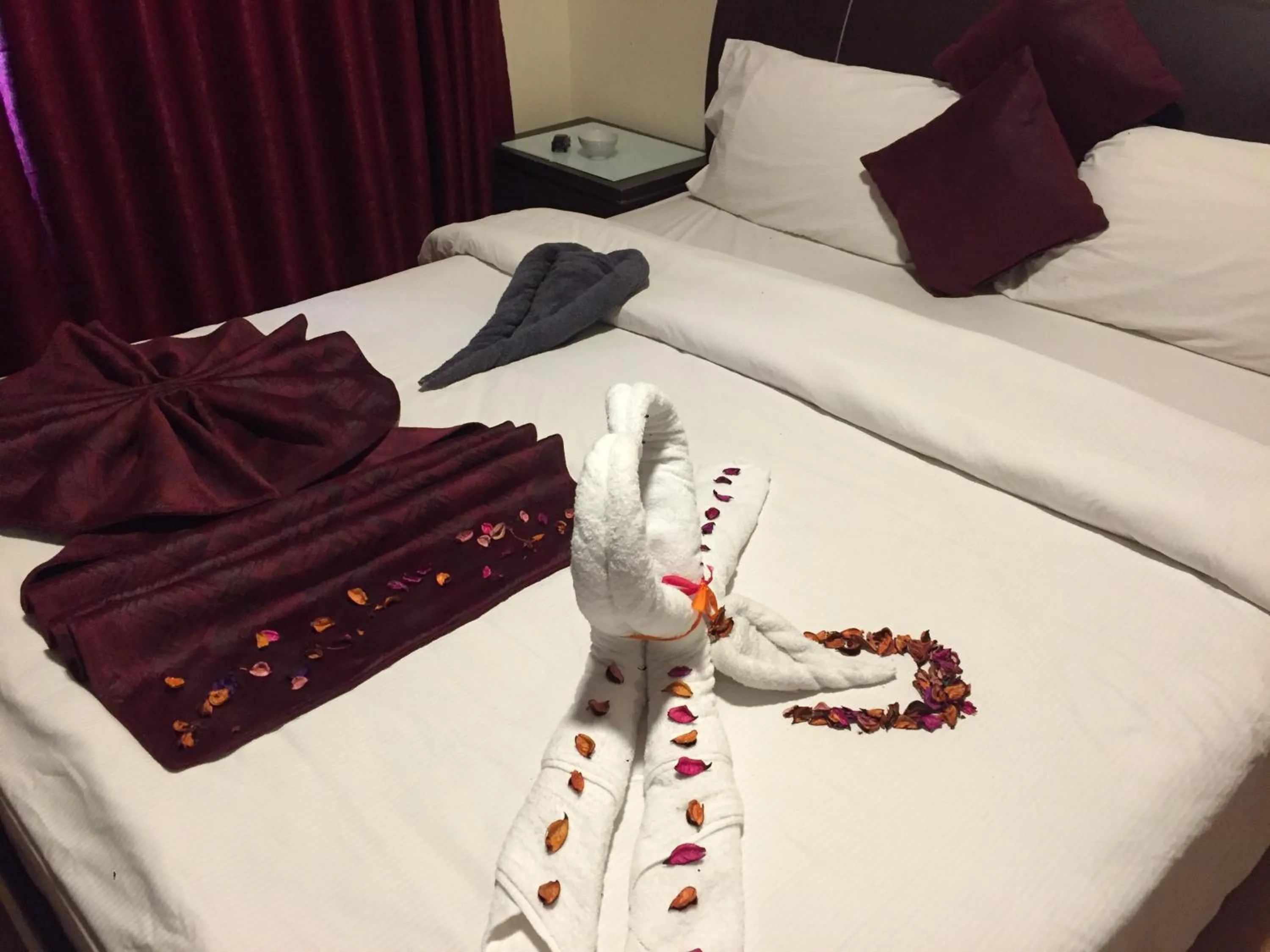 Bed in Uptown Hotel Apartment