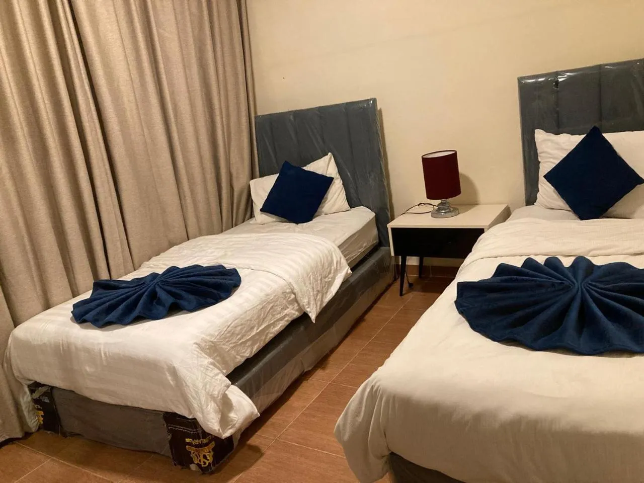 Bed in Uptown Hotel Apartment