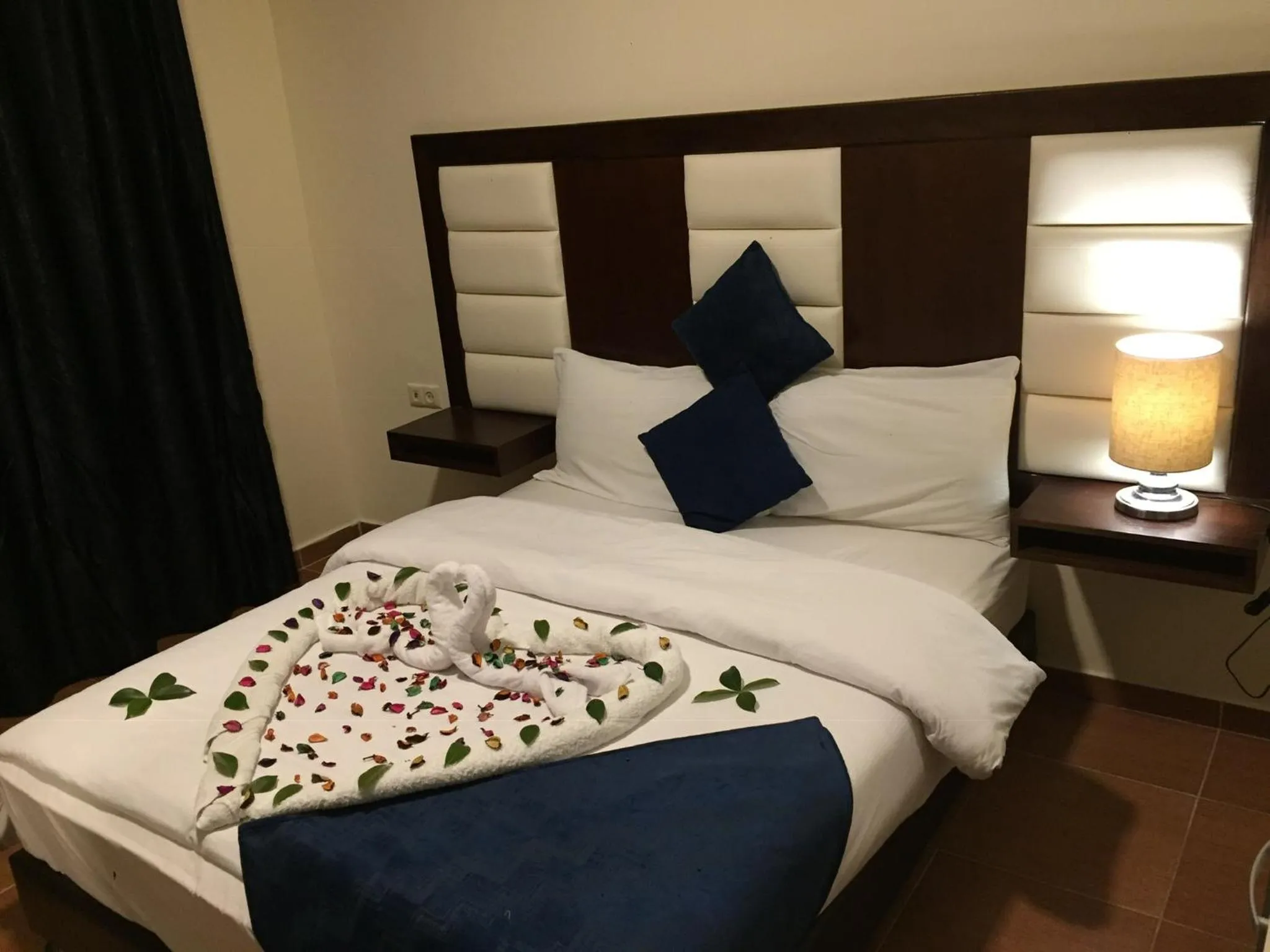 Bed in Uptown Hotel Apartment