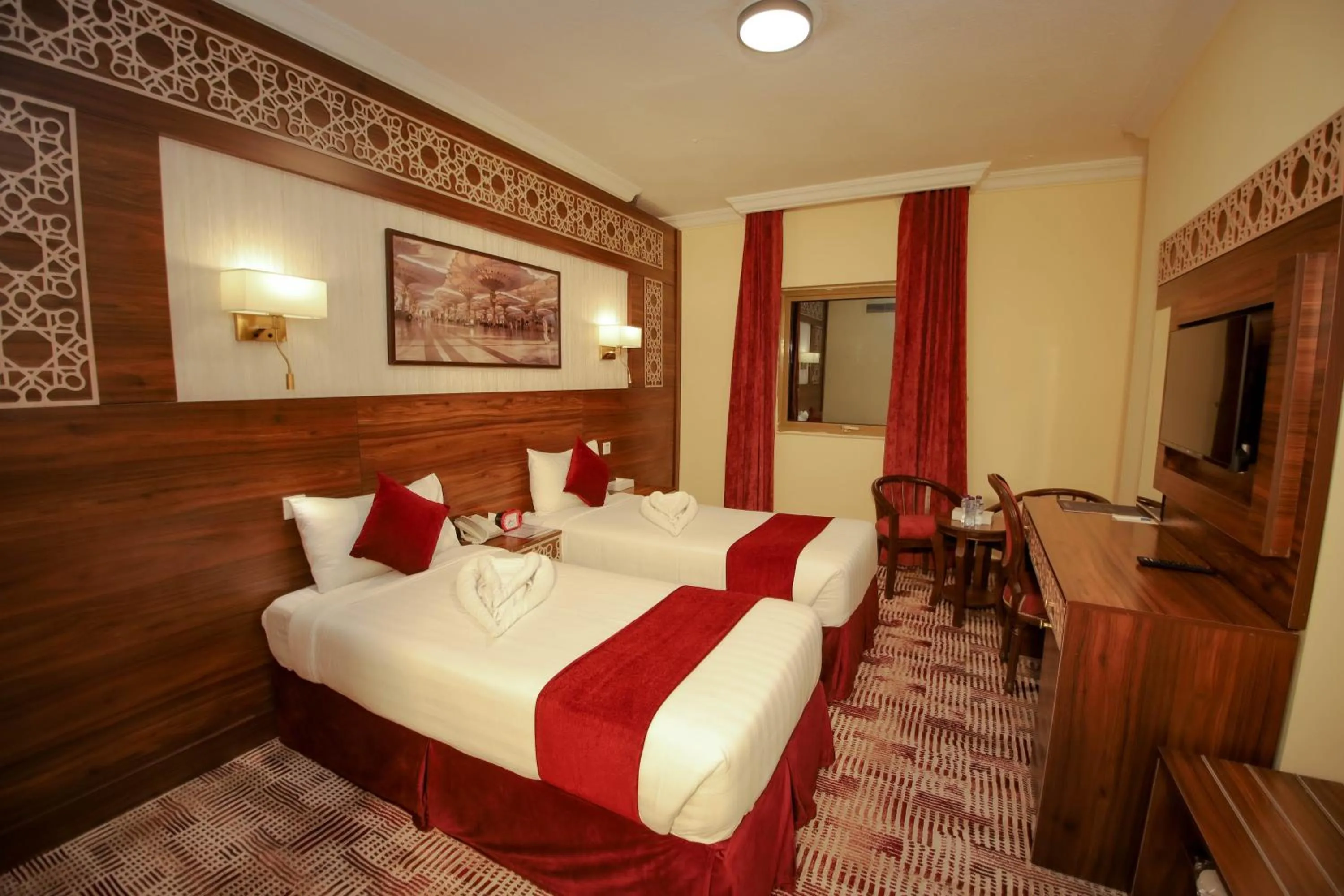 Bed in Abraj Al Tayseer Tuwa Hotel