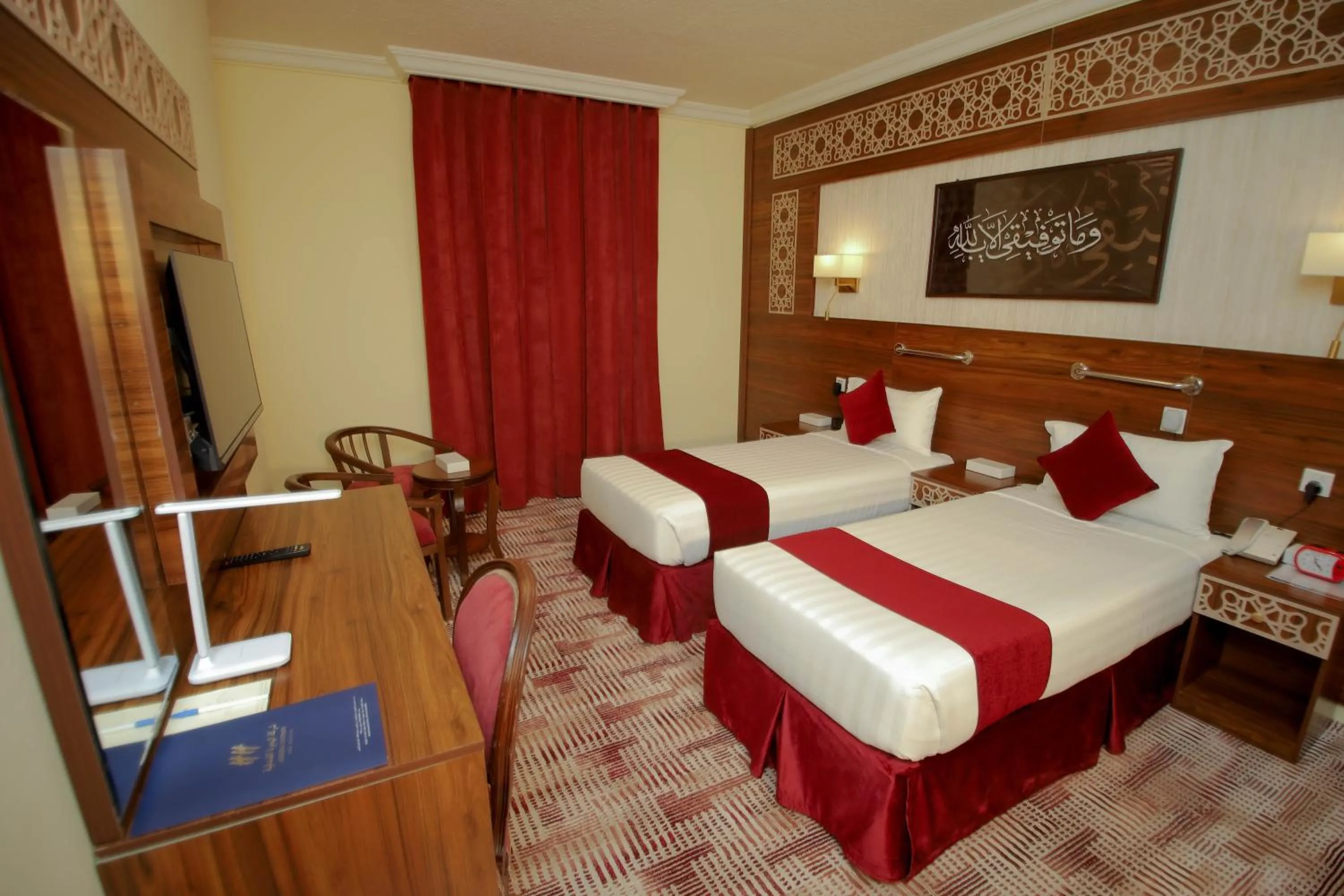 Bed in Abraj Al Tayseer Tuwa Hotel