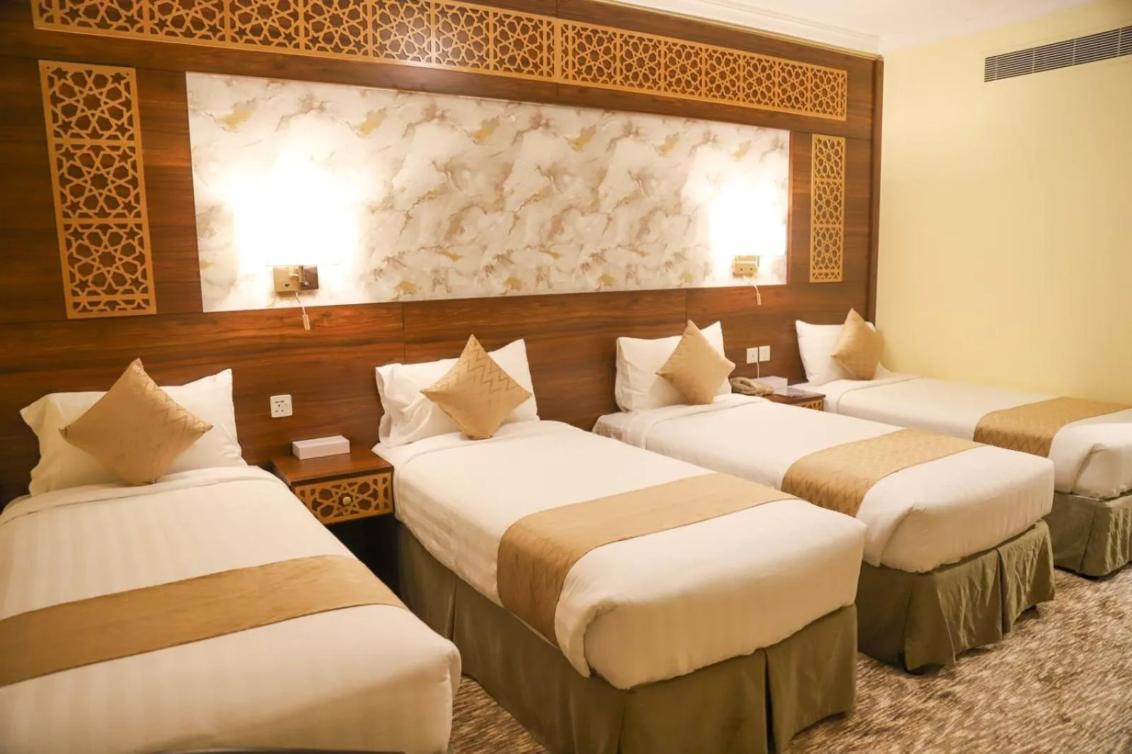 Bed in Abraj Al Tayseer Tuwa Hotel