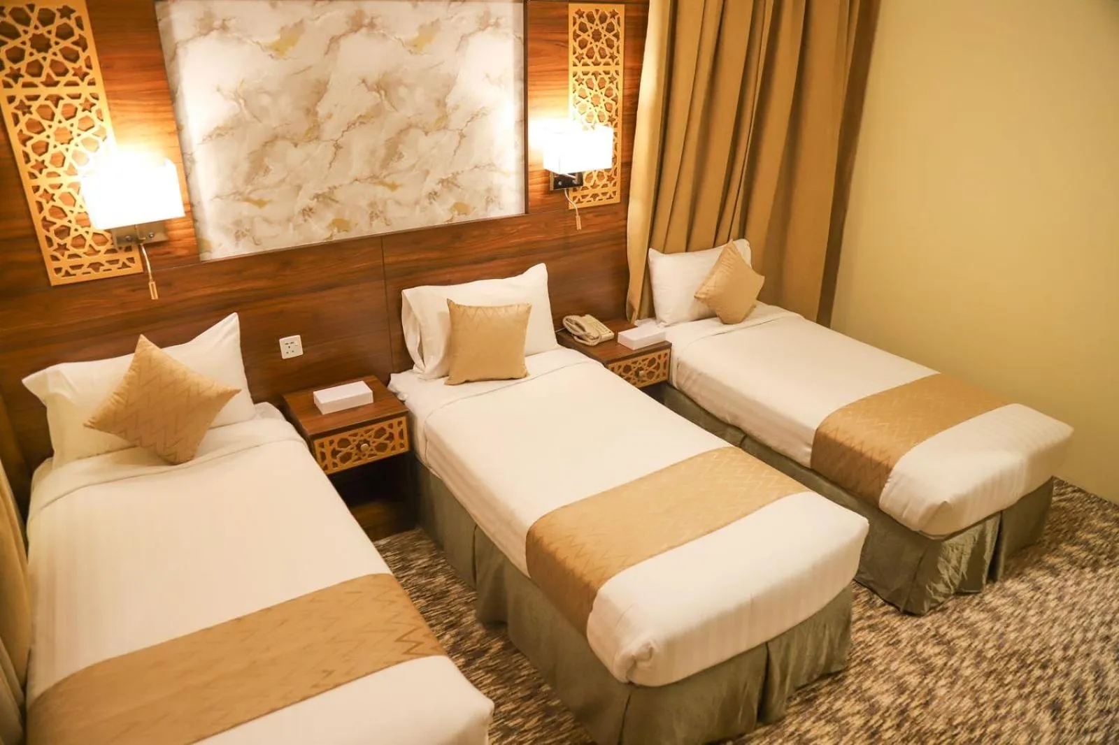 Bed in Abraj Al Tayseer Tuwa Hotel
