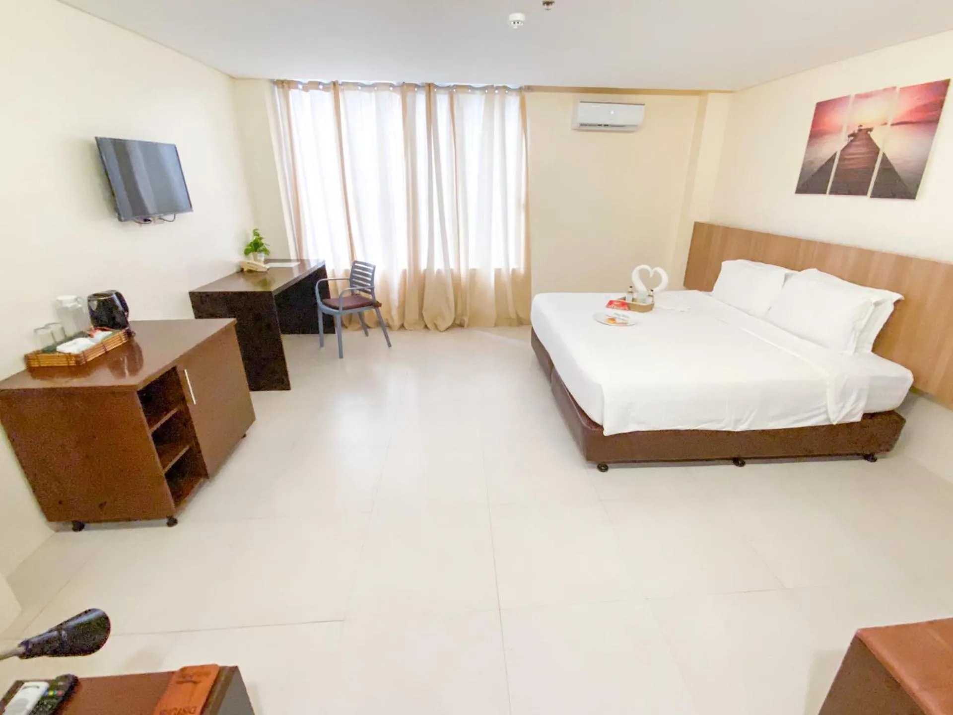 Bed in Ocean Suites Bohol Boutique Hotel