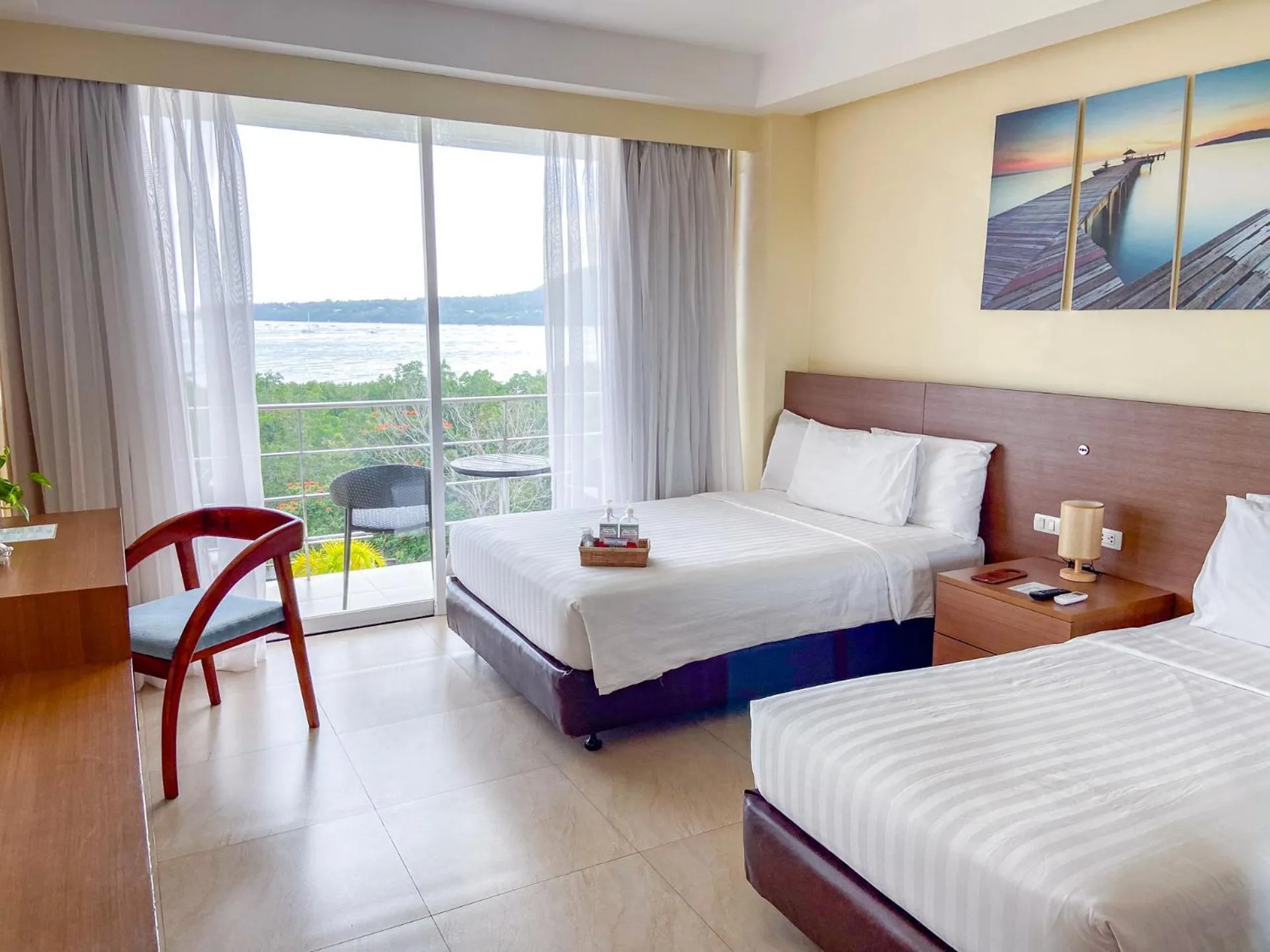 Bed in Ocean Suites Bohol Boutique Hotel