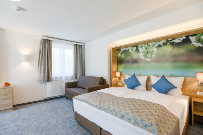 Bed in R&R Residenzen HOTEL