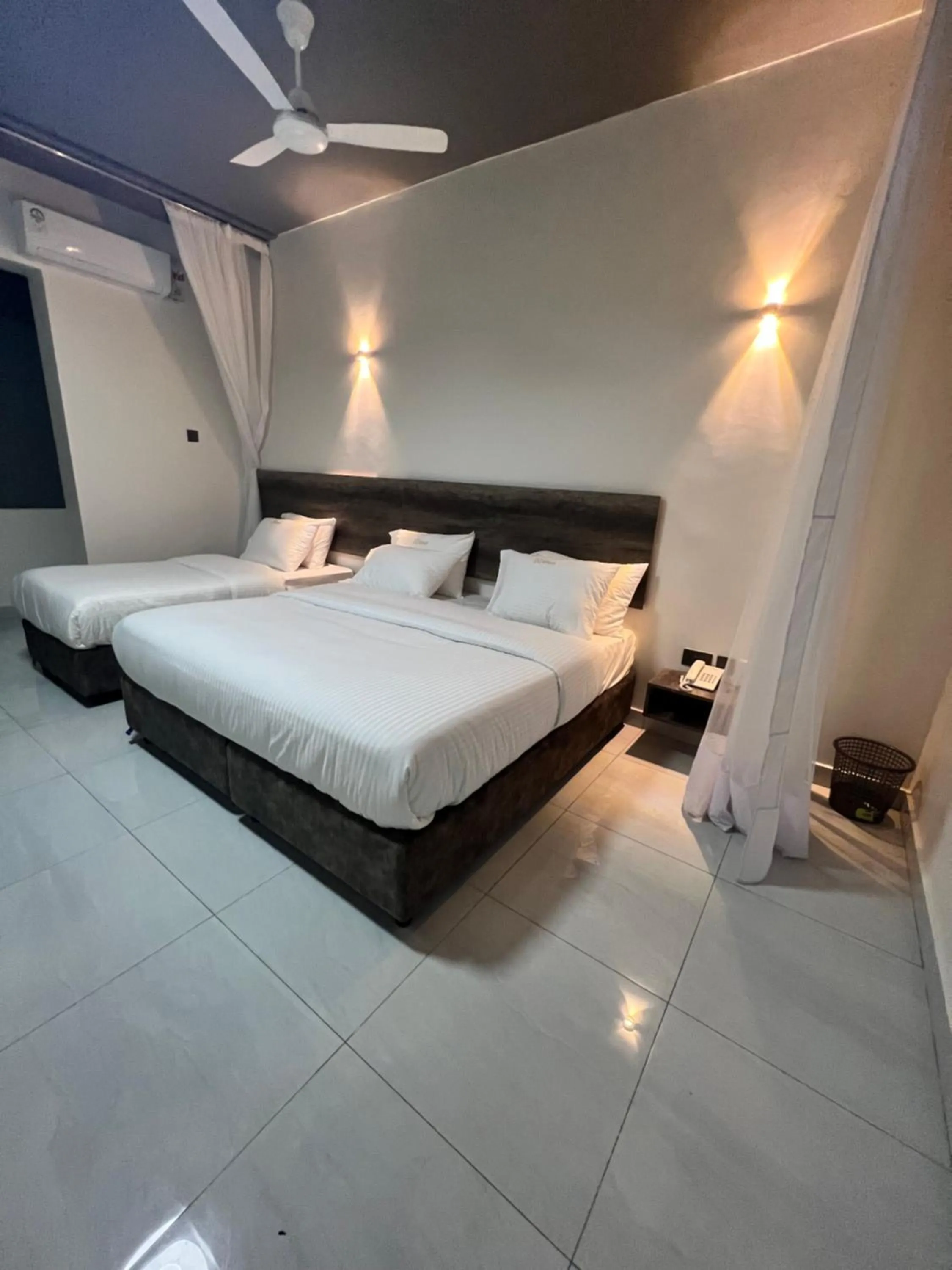 Bed in The Ivory Suites