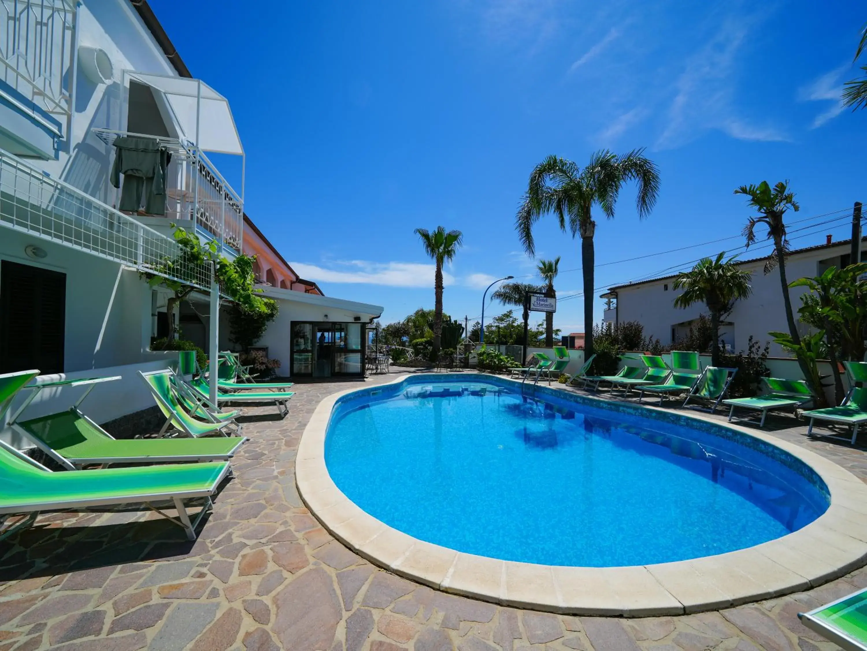 Property building in Hotel MARINELLA parking wi-fi spiaggia attrezzata Property building in Hotel MARINELLA parking wi-fi spiaggia attrezzata