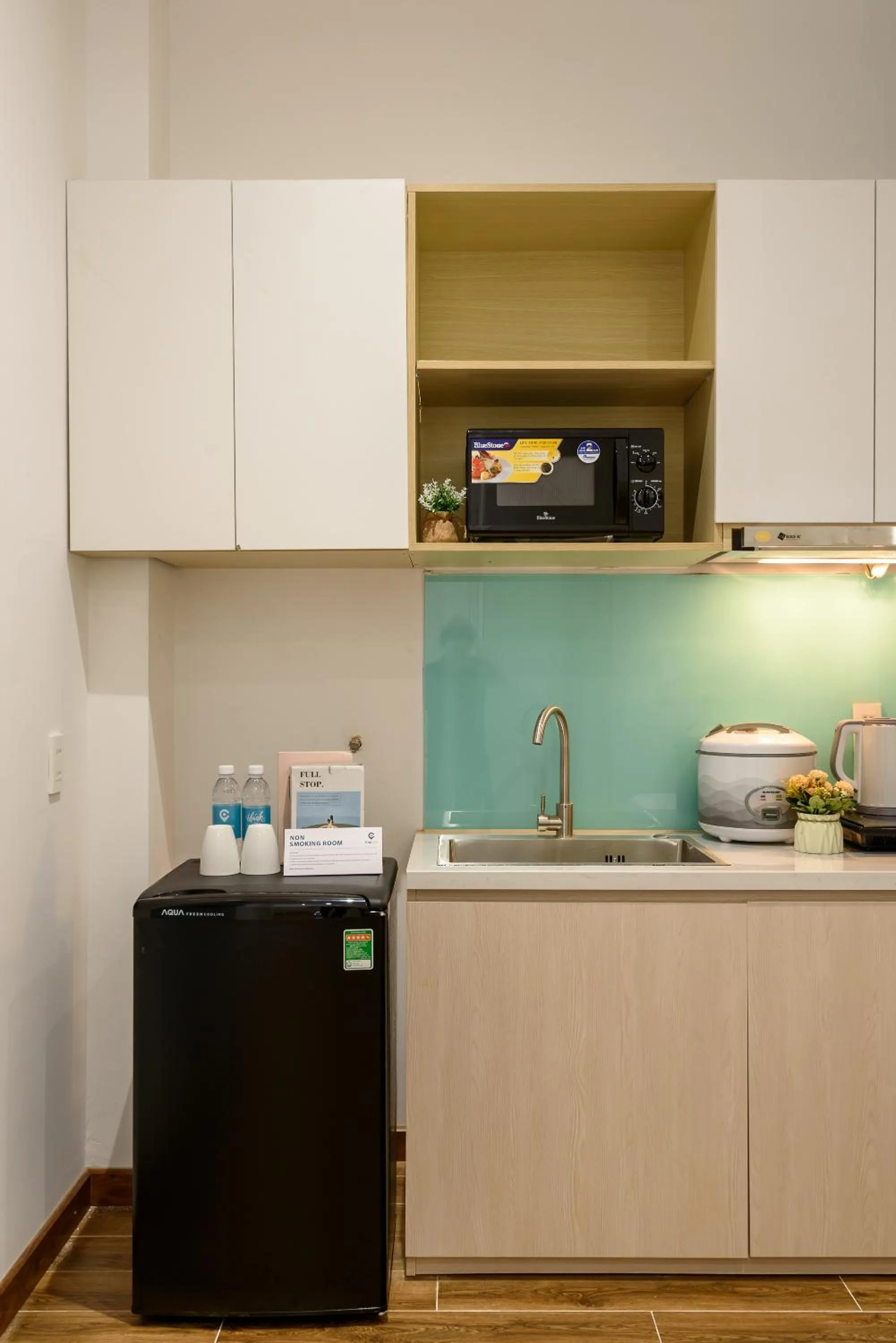 Kitchen or kitchenette in Cozrum Homes - June Corner