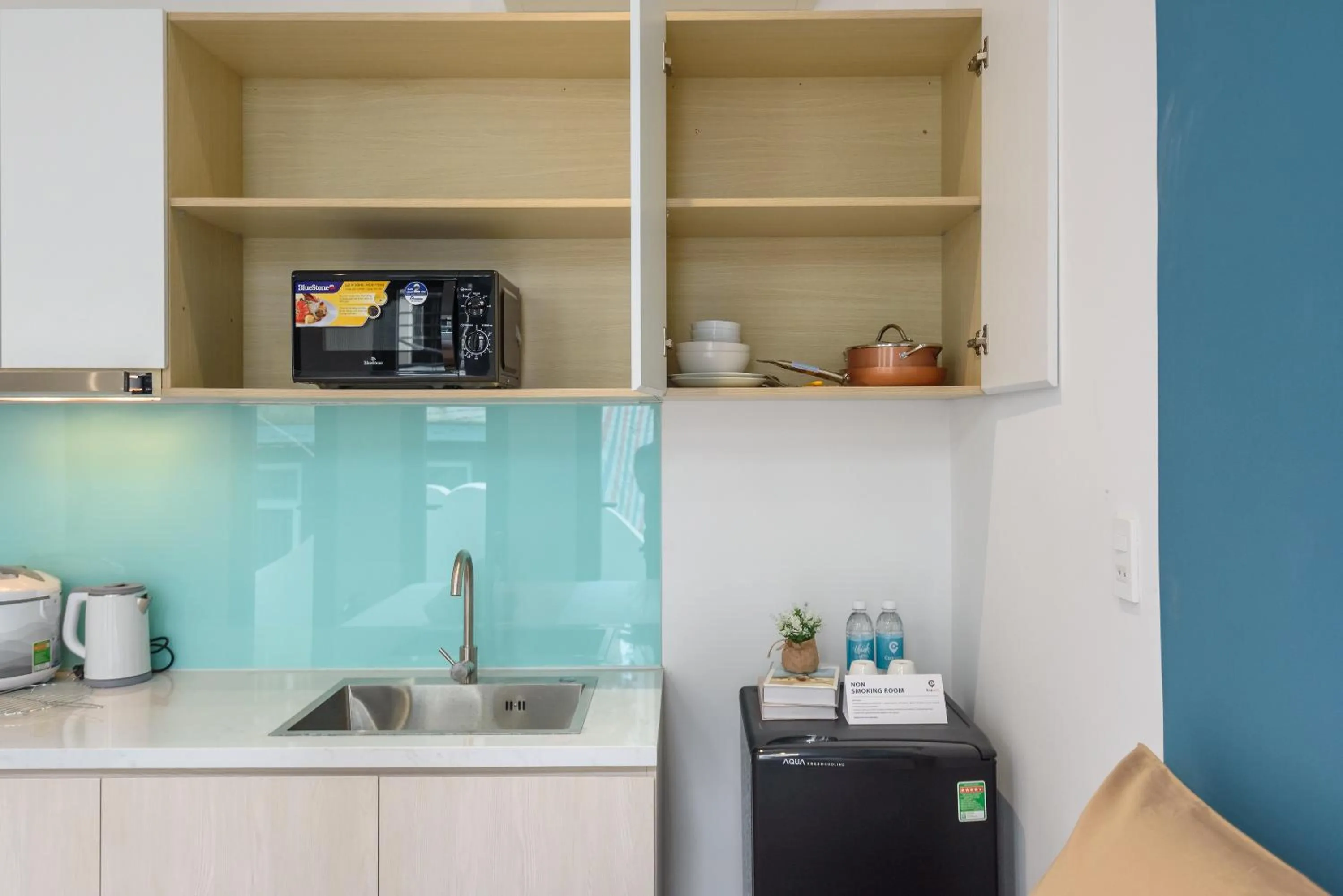 Kitchen or kitchenette in Cozrum Homes - June Corner