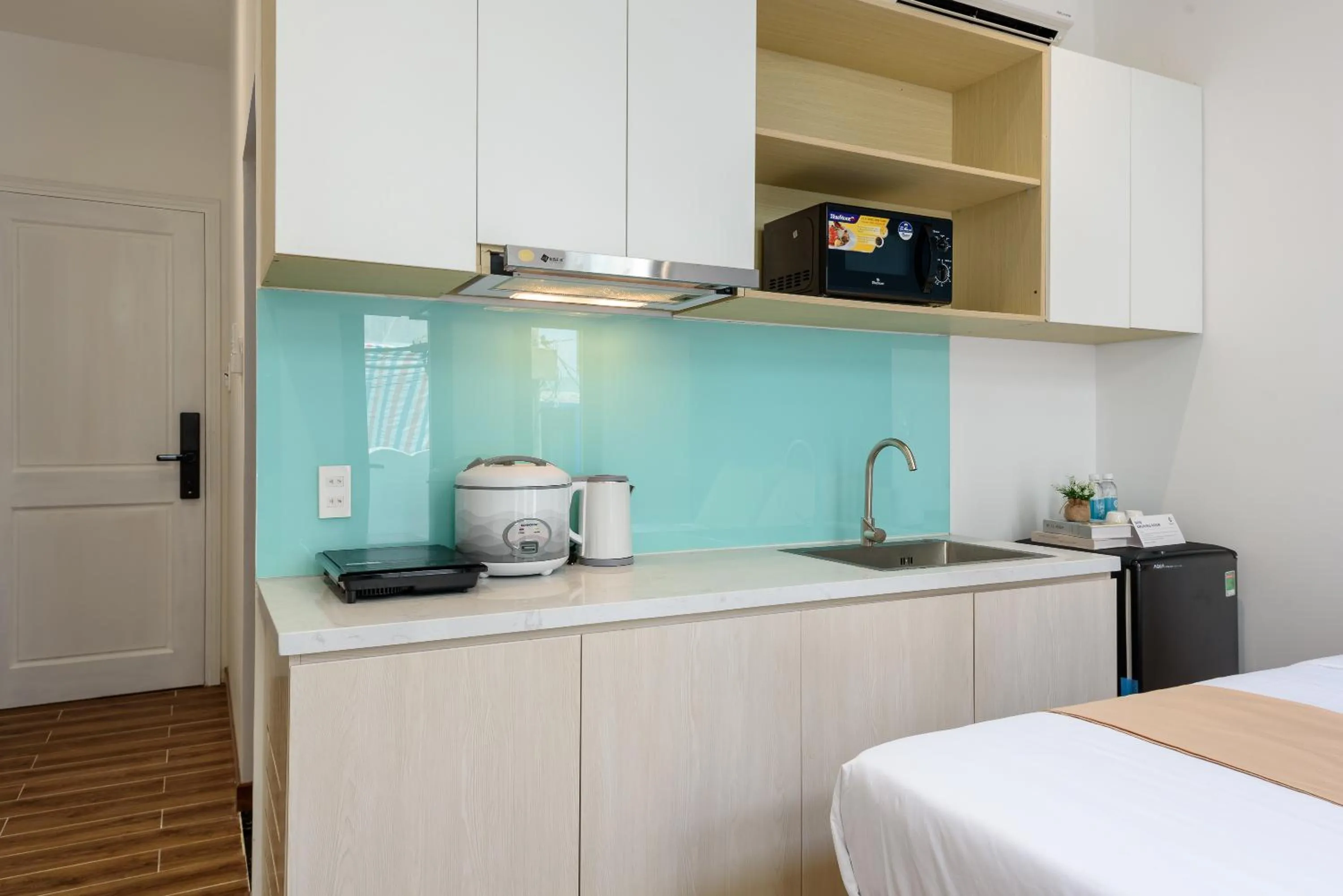 Kitchen or kitchenette in Cozrum Homes - June Corner