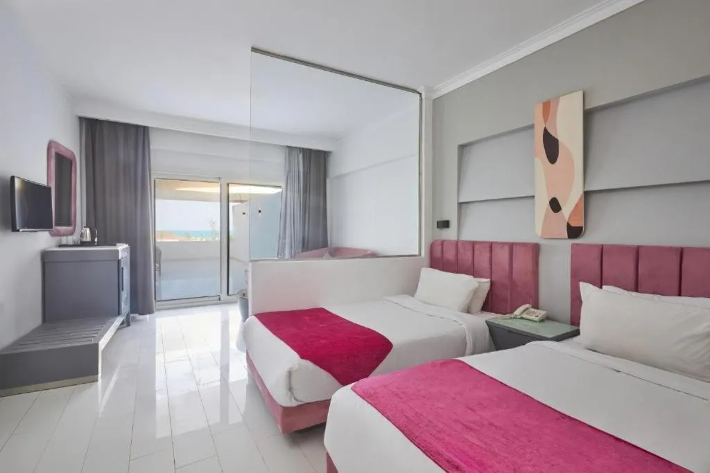 Bed in Golden Palace Marina Hotel