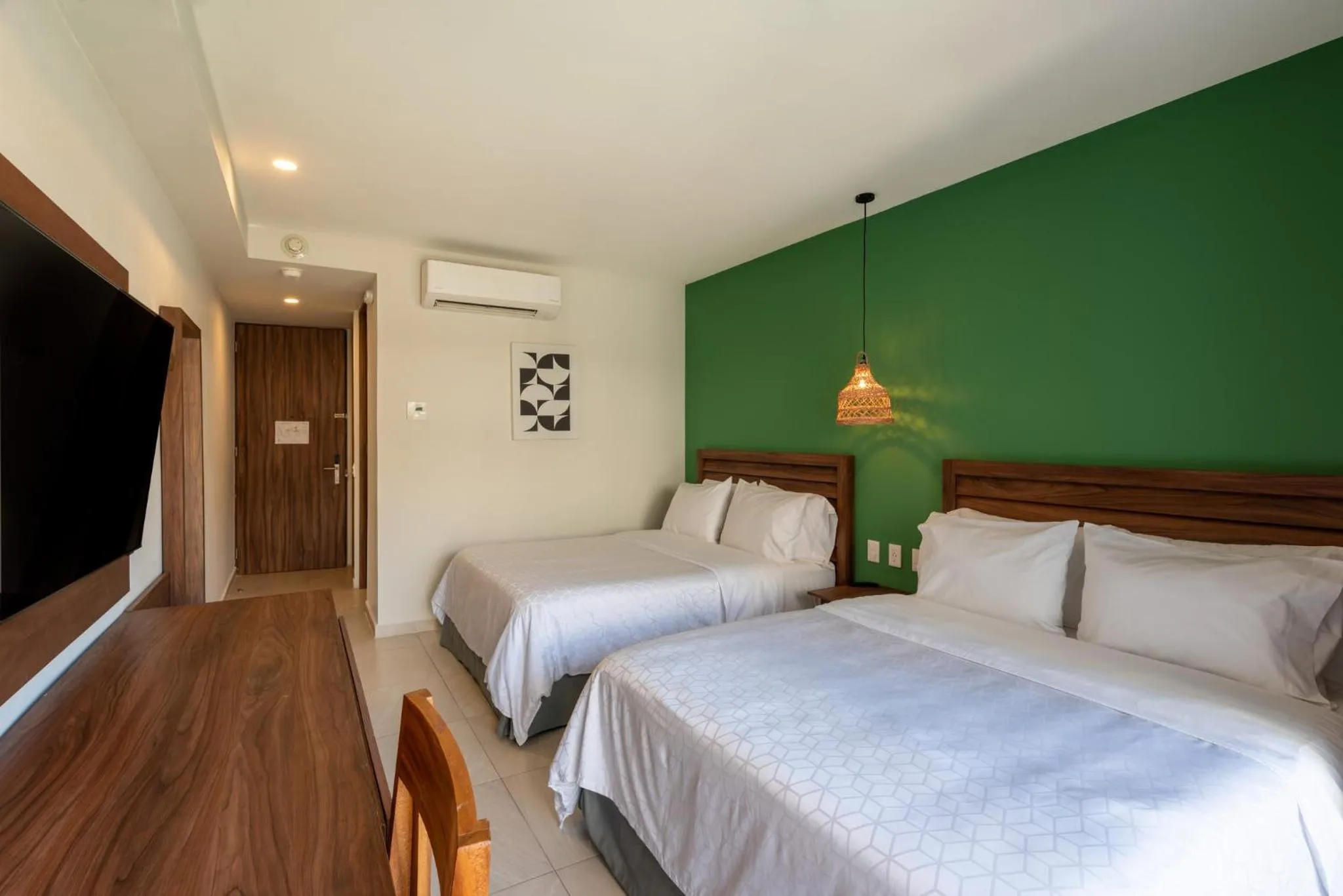 Photo of the whole room, Bed in Holiday Inn Tulum by IHG