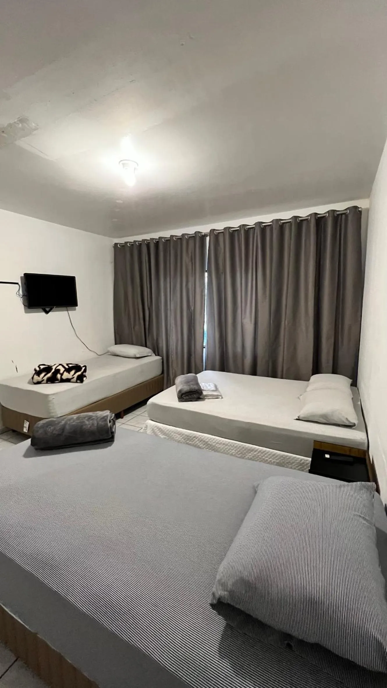 Bed in Pousada Central Jaraguá