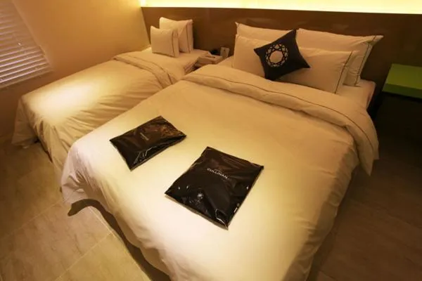 Bed in Jeju Cullinan Hotel