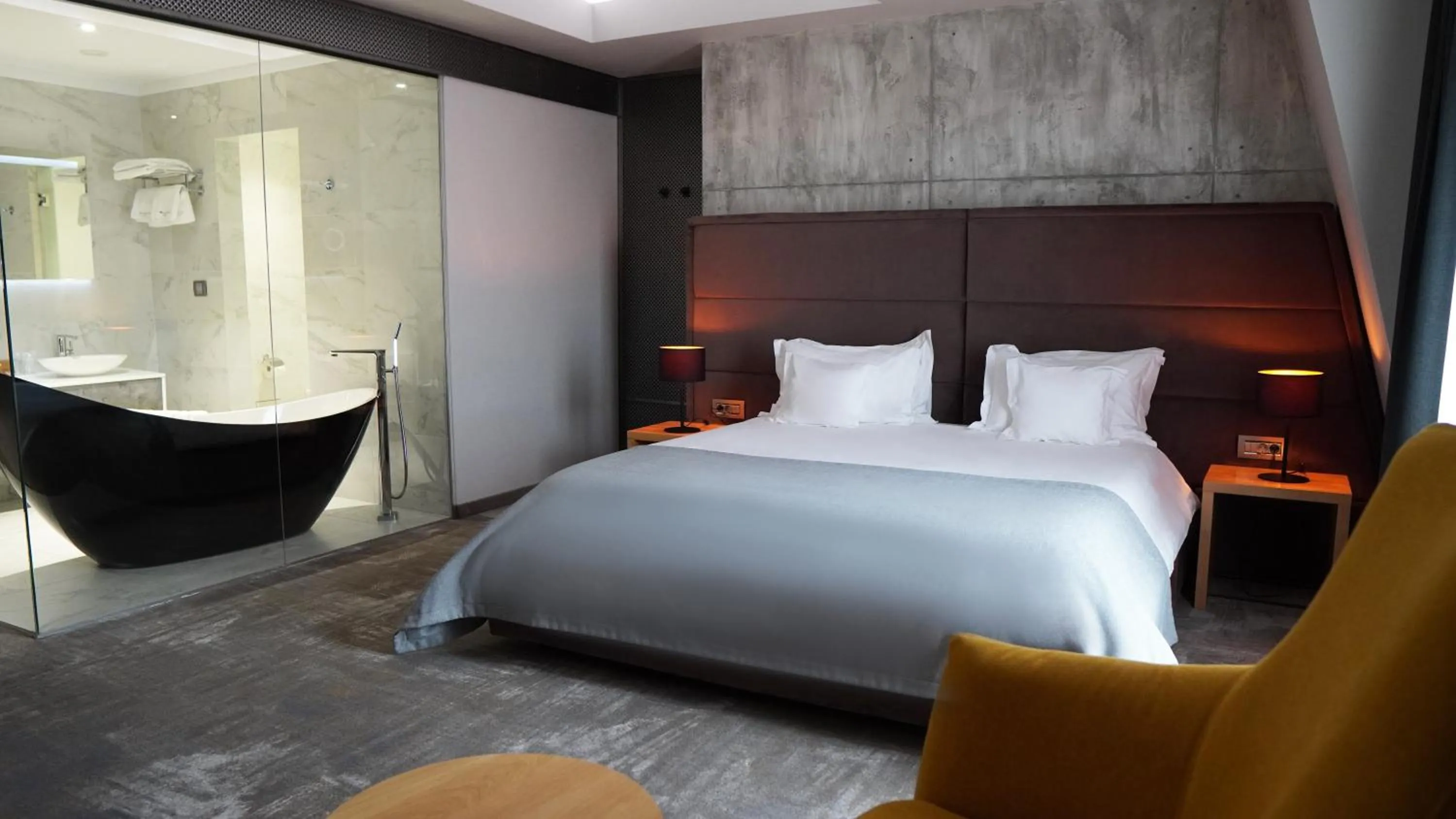 Bed in Aniroc Signature Hotel